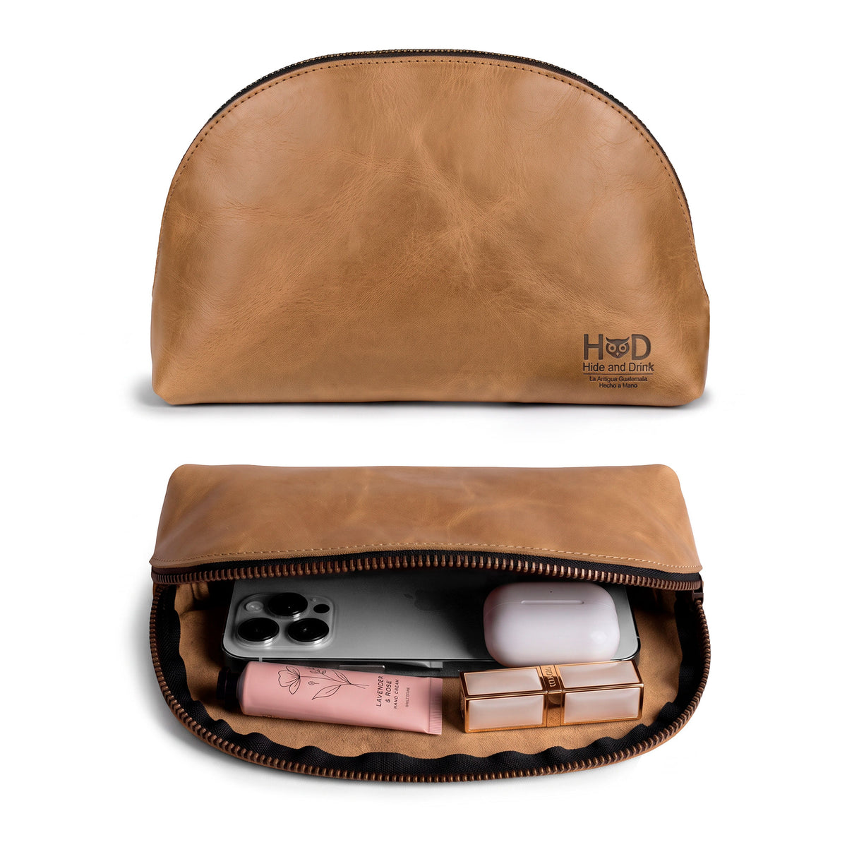 Open view of the Accessory Pouch Organizer Hand Bag by Hide & Drink, showcasing cosmetics inside. This elegant Cosmetic Travel Organizer with Hand Strap for Women serves as a Makeup Bag or Classic Handbag, handmade in La Antigua Guatemala & Oaxaca Mexico.