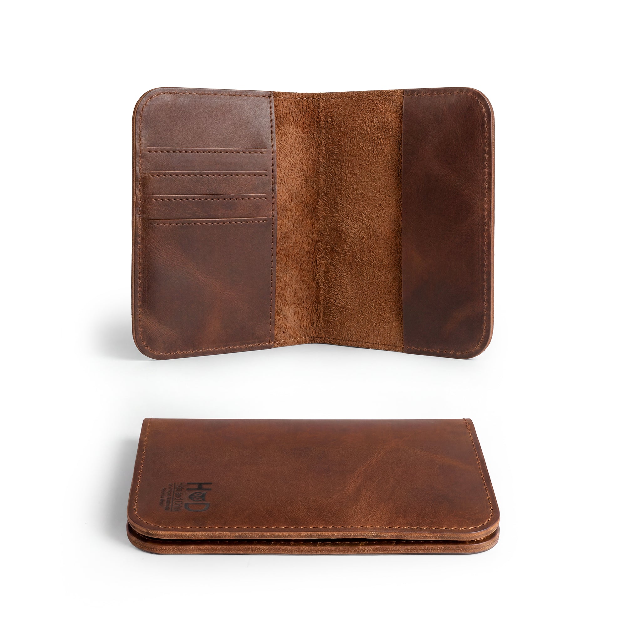 Open view of the Hide & Drink Travel Wallet, demonstrating ample space for cards and documents, ideal as a bifold passport case. This handmade travel wallet features a classic cover, crafted from premium leather, made in La Antigua Guatemala.