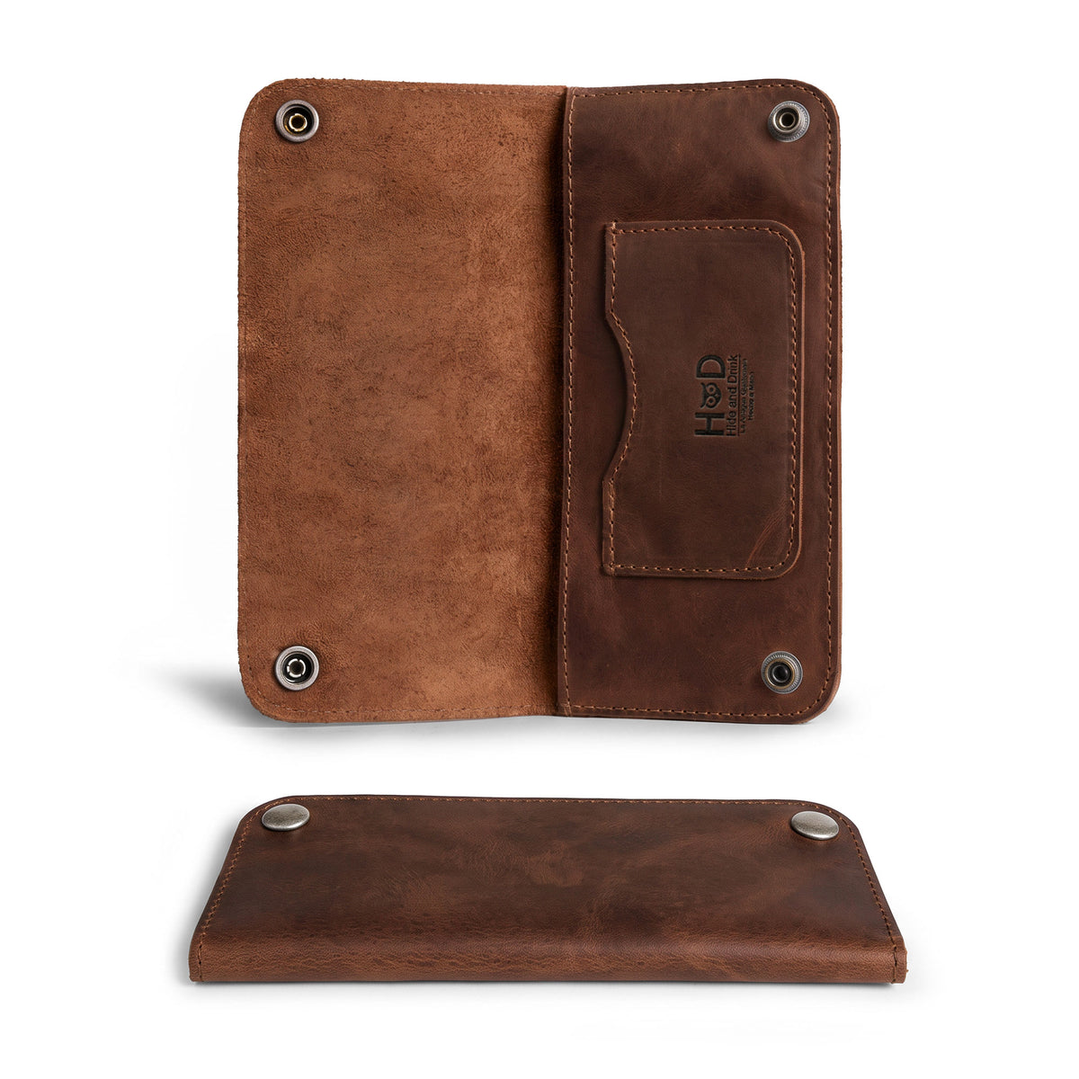 Inside view of the Brown Double Snap Folio Wallet by Hide & Drink, displaying cash and a card in its well-crafted full grain leather design. This rectangular flat bill holder with card slot functions beautifully as a night bag and travel accessory. Handmade in La Antigua Guatemala & Oaxaca Mexico, it reflects small batch production with fire branded quality.