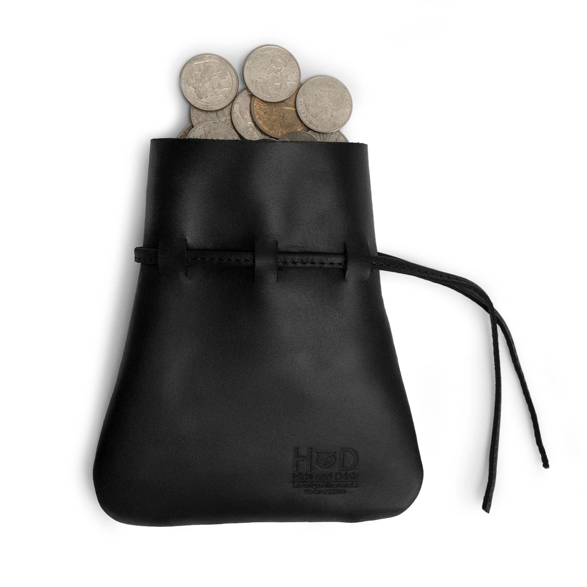 The Medieval Coin Pouch by Hide & Drink, filled with coins, displays its functional elegance. This Medieval Drawstring Coin Pouch is a fantastic option for cosplay enthusiasts or everyday users, handcrafted from Full Grain Leather with artisan precision and small batch production. Handmade in La Antigua Guatemala & Oaxaca Mexico.
