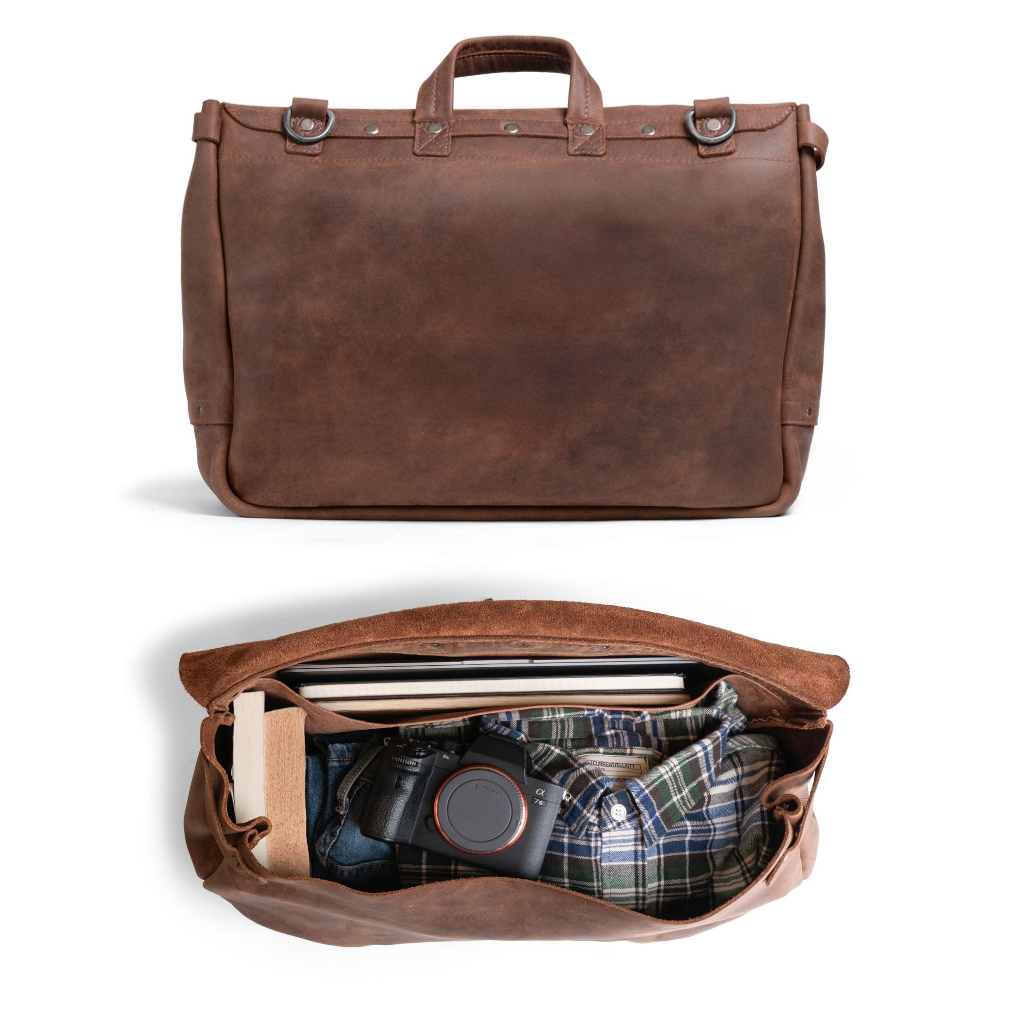 Interior view of the Vintage Mail Carrier Weekend Duffle by Littlefield & Co., displaying spacious storage for essentials. This Mail Carrier Satchel with Adjustable Shoulder Strap is a practical Messenger Bag and Large Briefcase, made from Full Grain Leather, crafted through StockyardX's Small Batch Production, featuring hand-cut, hand-sewn details from skilled artisans in La Antigua Guatemala & Oaxaca Mexico.