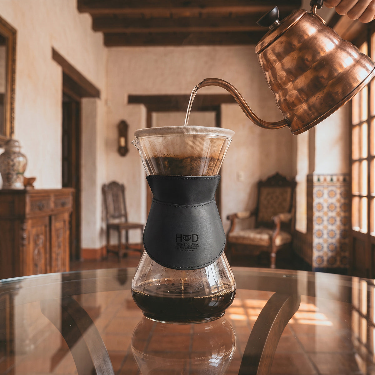 Close-up of Hide & Drink Chemex Collar in black leather, showing its unique design and craftsmanship, perfect for pour over coffee. This collar is compatible with Chemex 6-Cup Glass, handmade in La Antigua Guatemala & Oaxaca Mexico.