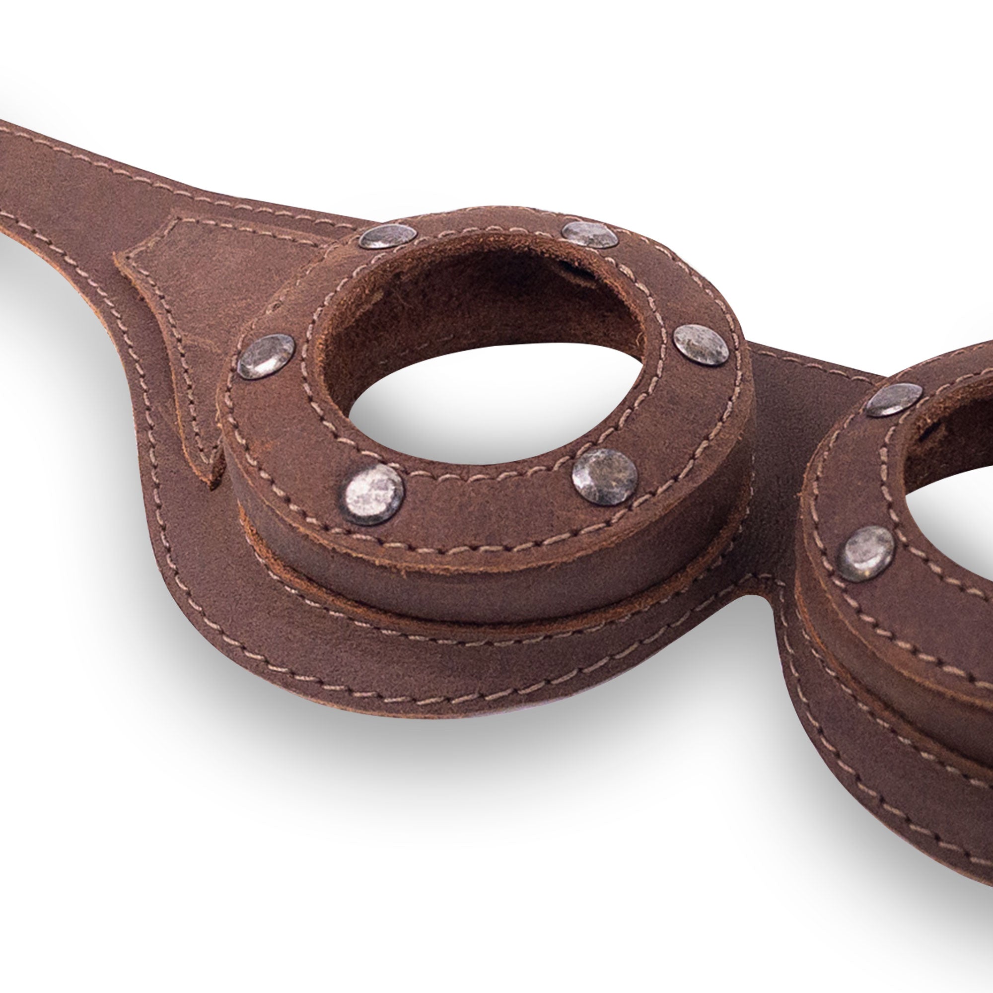 Close-up view of the Riveted Steampunk Goggles by Hide & Play, highlighting intricate details and full grain leather material. These handmade goggles are perfect for steampunk attire and retro cosplay, showcasing artisan craftsmanship and small batch production.