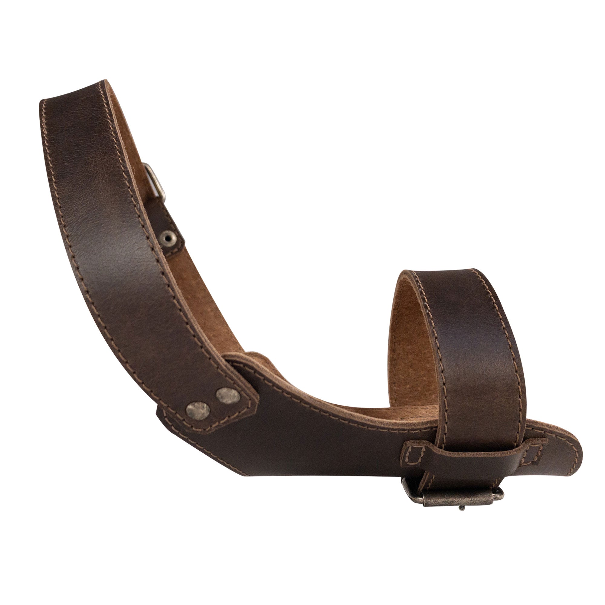 Profile view of the Adjustable Dog Muzzle by Taco Dog, highlighting its unique rustic design perfect for preventing chewing. Crafted from full grain leather, this artisan muzzle is hand cut and hand sewn for a durable and stylish pet accessory.