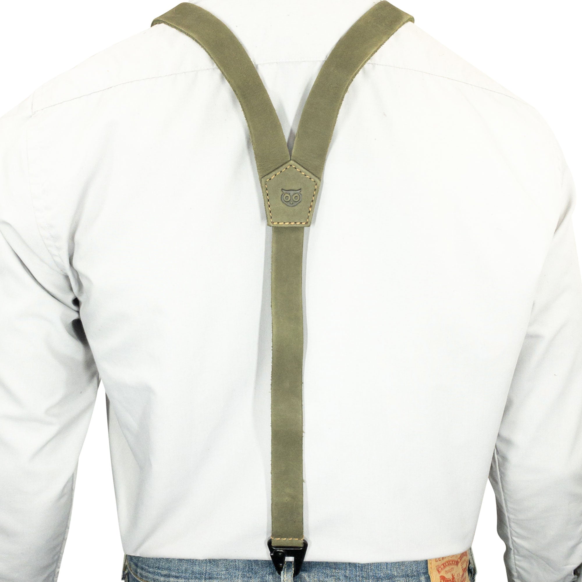 Close-up of the details of Hide & Drink Rustic Slim Suspenders in olive, highlighting the hand sewn finish and quality leather craftsmanship, ideal for formal occasions.