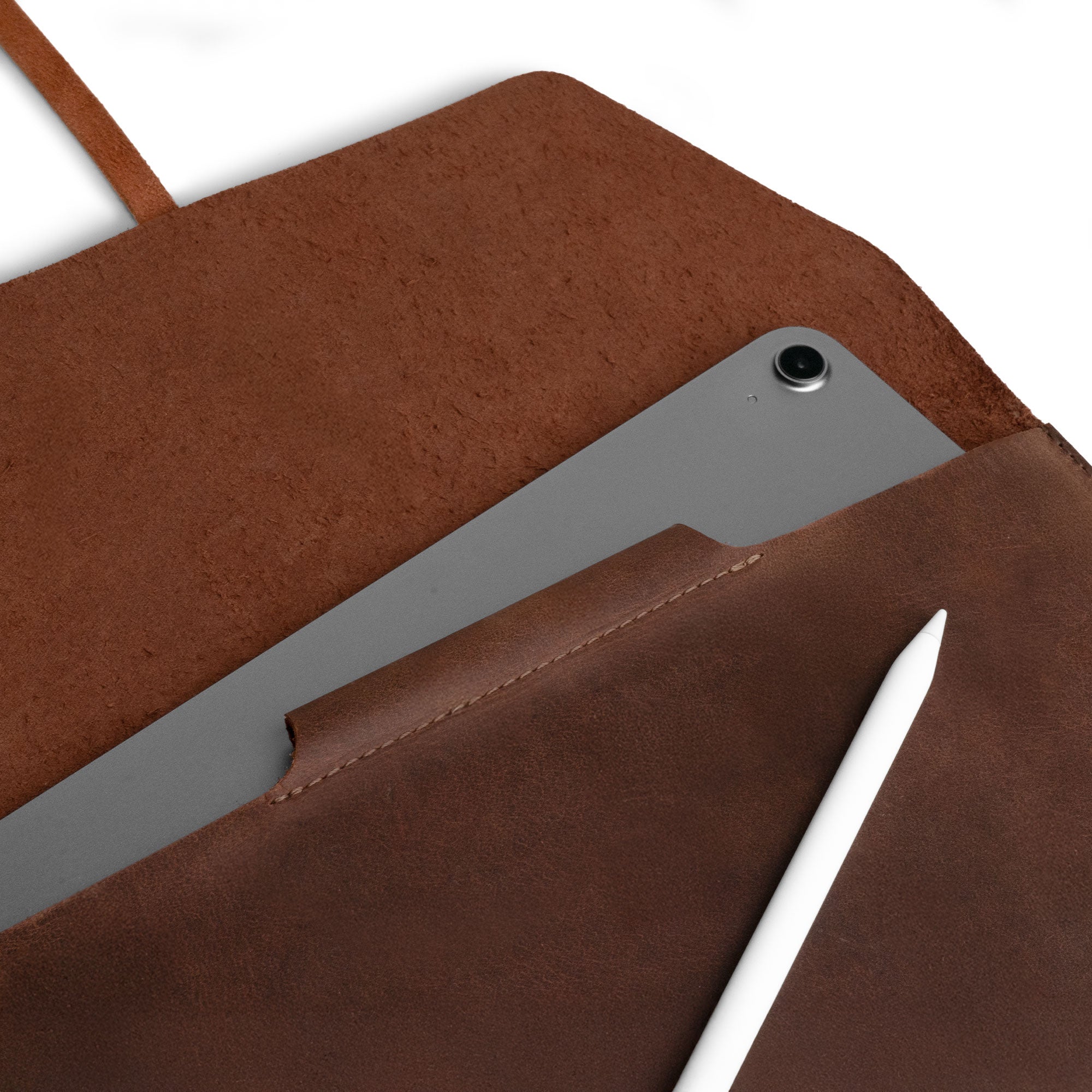 Inside view of the Leather Worx Envelope 11-inch Tablet Cover showing the snug fit for the iPad Air 11 Inch Case Leather (2024) along with space for the Apple Pencil. This envelope sleeve is crafted from full grain leather and features a pencil holder, designed specifically for the 5th Generation Tablet with M2 Chip. The product emphasizes artisan craftsmanship, handmade in La Antigua Guatemala & Oaxaca Mexico with attention to detail through hand cut and hand sewn techniques.