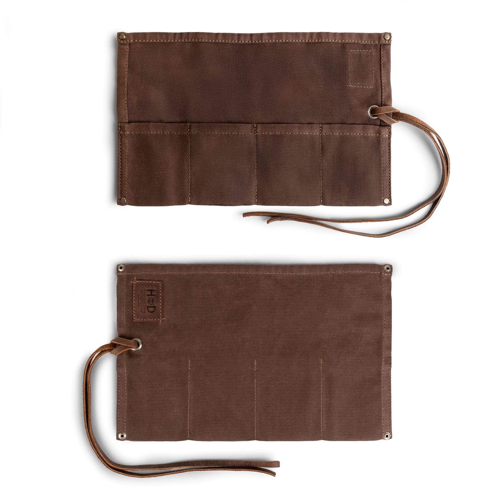 The sturdy back of Hide & Drink's Waxed Canvas Watch Roll, showcasing a simple yet functional design for organizing up to 4 watches. Artisan quality ensures durability.