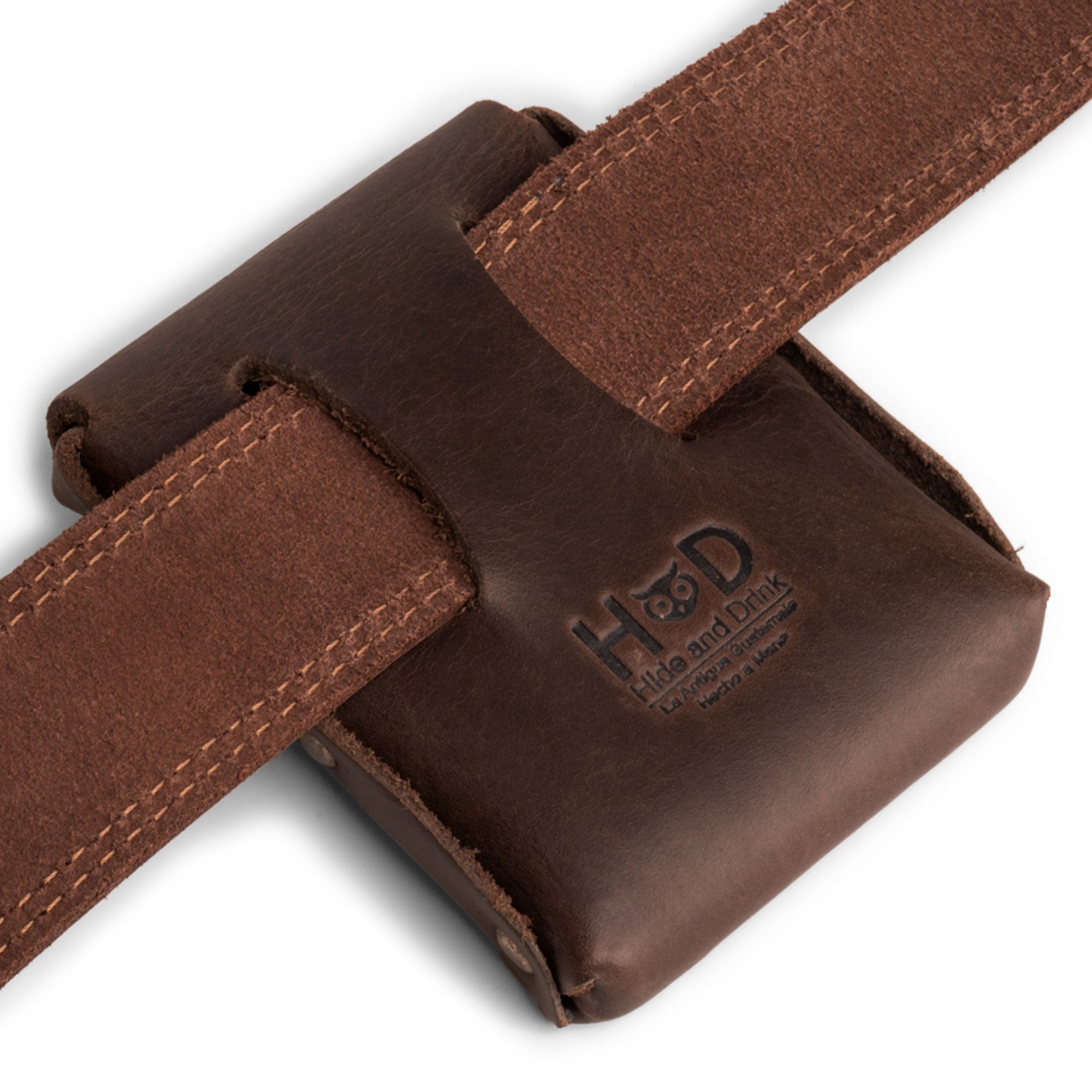Hide & Drink's Waist Wallet secured on a belt, providing easy access to up to 20 cards, folded bills & coins, and charging cables, made of durable full grain leather, emphasizing small batch production, hand cut, hand sewn, fire branded, artisan quality, handmade in La Antigua Guatemala & Oaxaca Mexico.