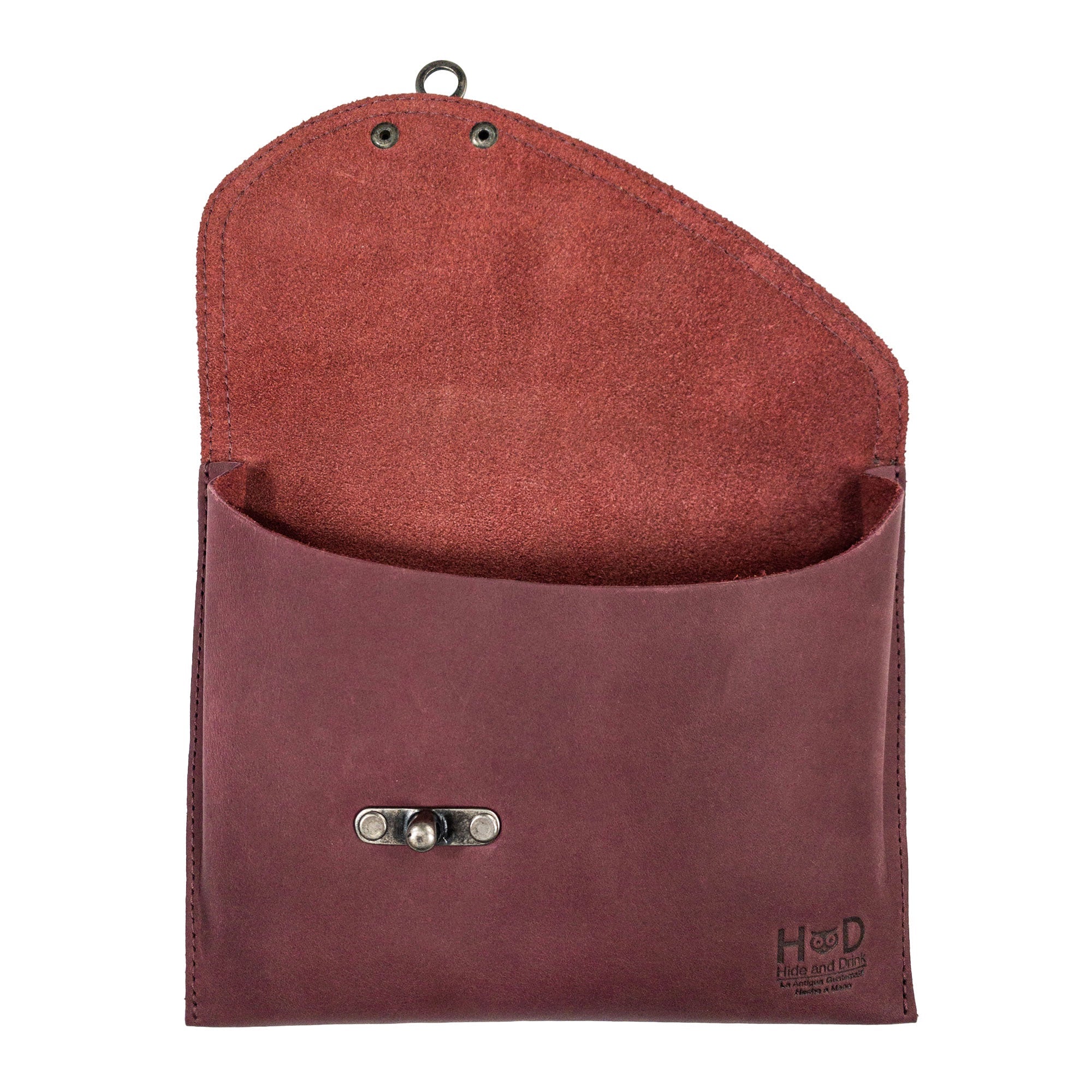 Open interior view of the Petite Vintage Clutch Bag by Hide & Drink, highlighting its spacious design. This unique vintage handbag features a soft raw natural leather lining, crafted from full grain leather, making it an excellent choice for a travel accessory. Hand cut, hand sewn, and handmade in La Antigua Guatemala & Oaxaca Mexico.