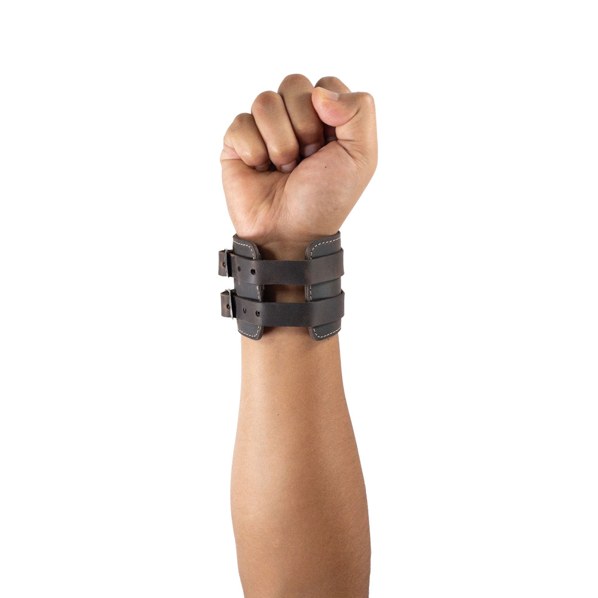 An elegant display of Hide & Drink's Wrist-Wallet-Cuff showcases its charming Full Grain Leather design. This rustic leather bracelet incorporates a hidden pouch for bills and an inner zippered pouch for organization. Each piece is handmade in La Antigua Guatemala & Oaxaca Mexico, reflecting the artisan quality and care.