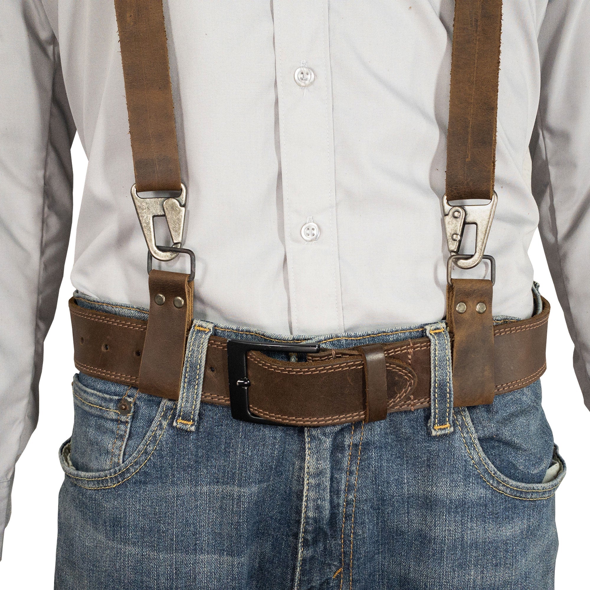 A model wearing the Set of 2 Riveted Suspender Loop Attachments by Hide & Groom, showcasing how these full grain leather suspender loops complement a stylish outfit. Perfect for men looking for heavy-duty wedding accessories, these artisan-crafted pieces are handmade in La Antigua Guatemala & Oaxaca Mexico.