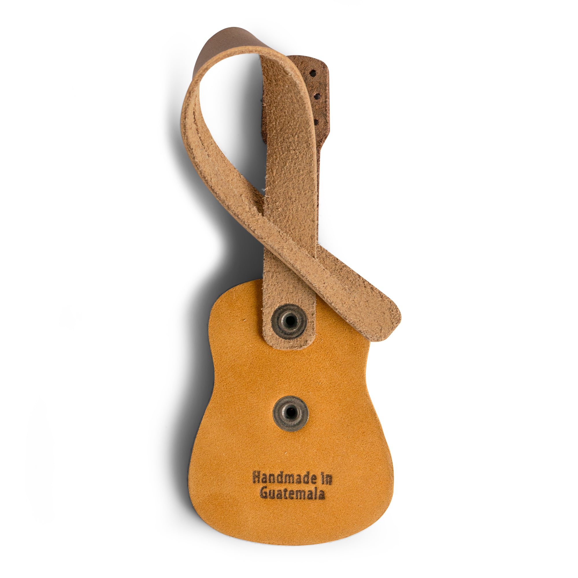 Bag Charms by Austin Genuine highlights a guitar charm labeled 'Handmade in Guatemala.' This Austin Genuine Bag Charm showcases 7 unique designs made with full grain leather from StockyardX, crafted through small batch production, hand cut, hand sewn, and fire branded, artisan, handmade in La Antigua Guatemala & Oaxaca Mexico.