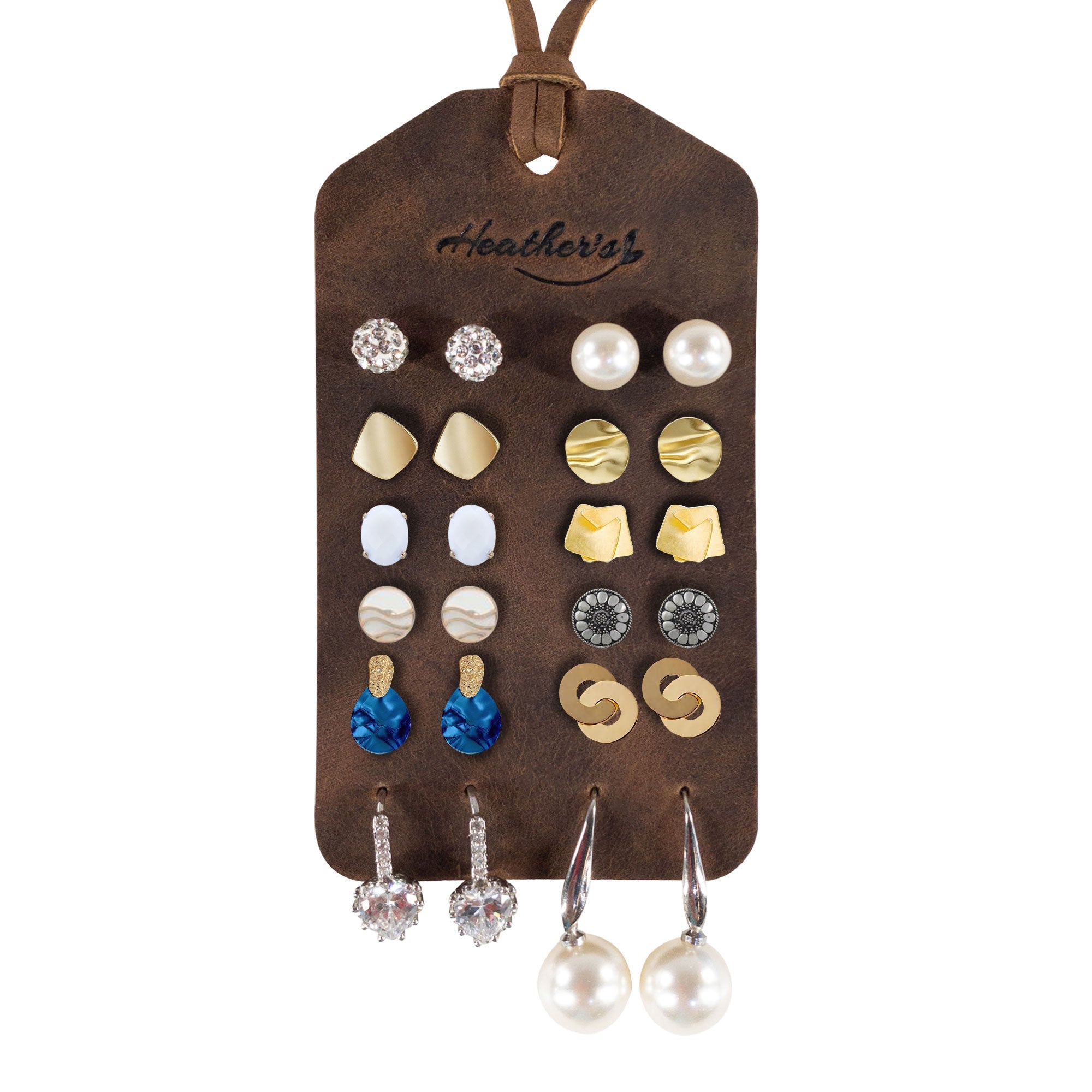 Set of 2 Earring Tags by Heather's featuring a stylish array of earrings on display. Made from full grain leather, these artisan-crafted tags include pre-cut holes for secure earring storage, perfect as a travel accessory and handmade in La Antigua Guatemala & Oaxaca Mexico.