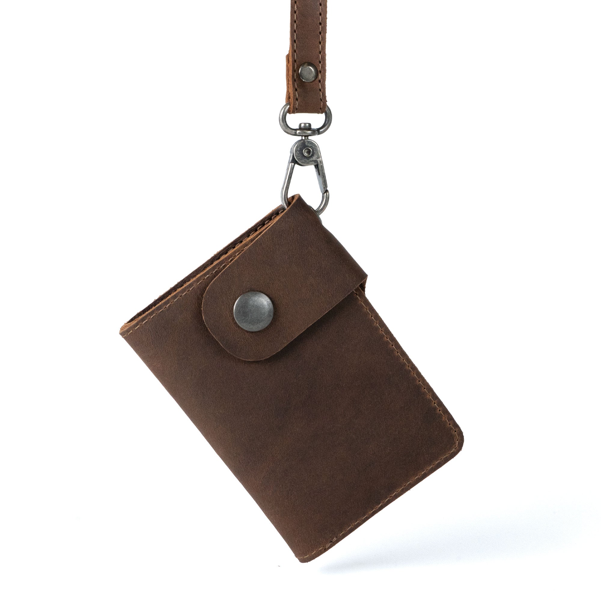 Hide & Ride Biker Wallet hanging with a detachable strap. The stylish rectangular wallet serves as a compact wallet with a belt loop and strap, ideal for bikers needing a card holder with a snap closure.