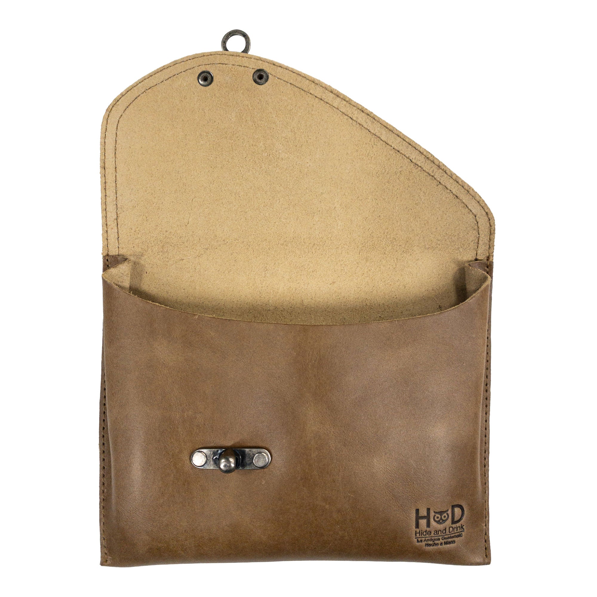 Open interior of the tan Petite Vintage Clutch Bag by Hide & Drink, showing its practical design. This elegant handbag crafted from full grain leather makes a great evening bag or travel accessory, emphasizing the artisan touch from small batch production in La Antigua Guatemala & Oaxaca Mexico.