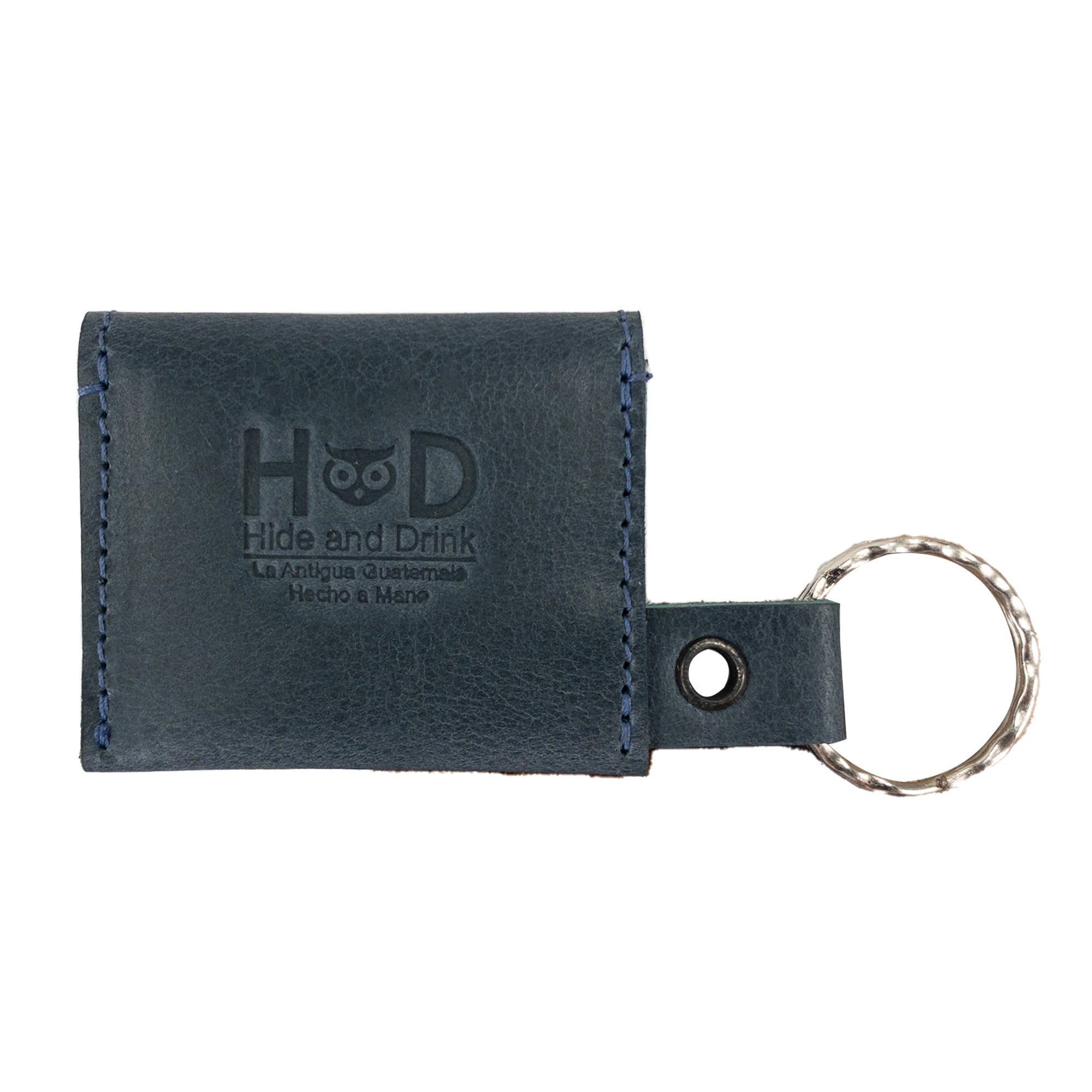 Tiny Coin Holder Keychain by Hide & Drink displaying its practical design, perfect for coins and keys. This lovely piece made of Full Grain Leather signifies the work of small batch production artisans.