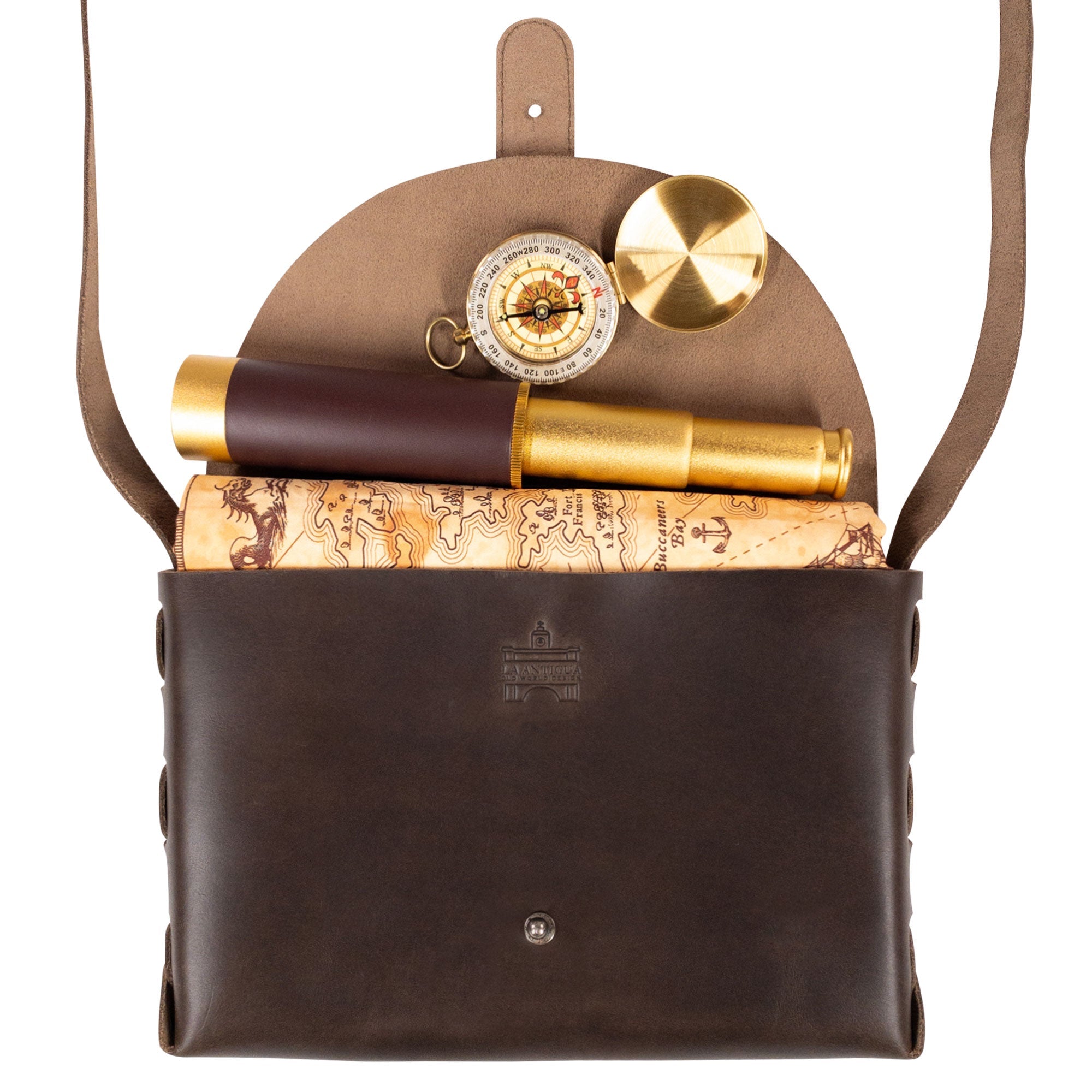 Vintage Leather Satchel by La Antigua, open to reveal items inside, emphasizing its spacious design. This classic style messenger bag made from full grain leather is hand cut and hand sewn, blending functionality and artisan craftsmanship.