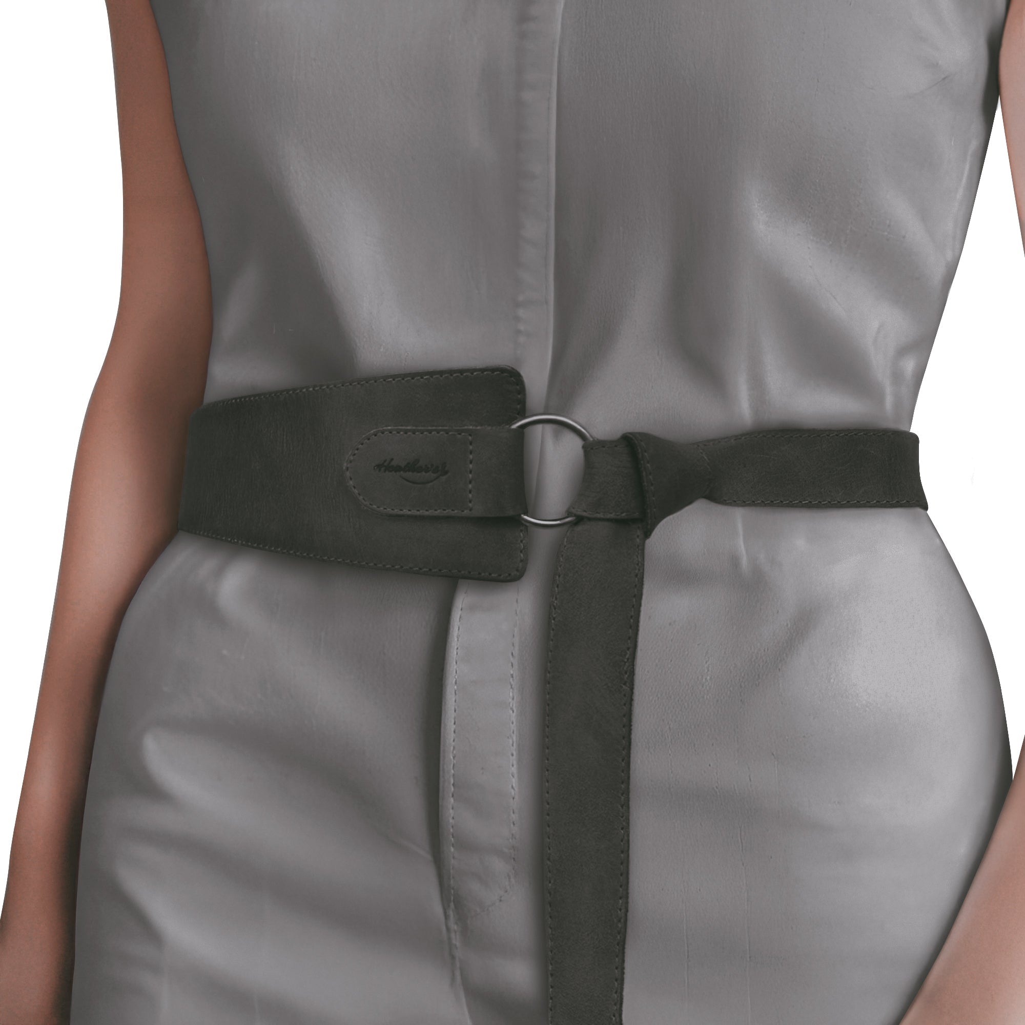 Model showcasing Heather's Formal Belt for Women with Ring in black, designed to enhance any outfit. This No-Buckle Belt, made from Full Grain Leather, is a unique belly accessory hand crafted by artisans in La Antigua Guatemala.