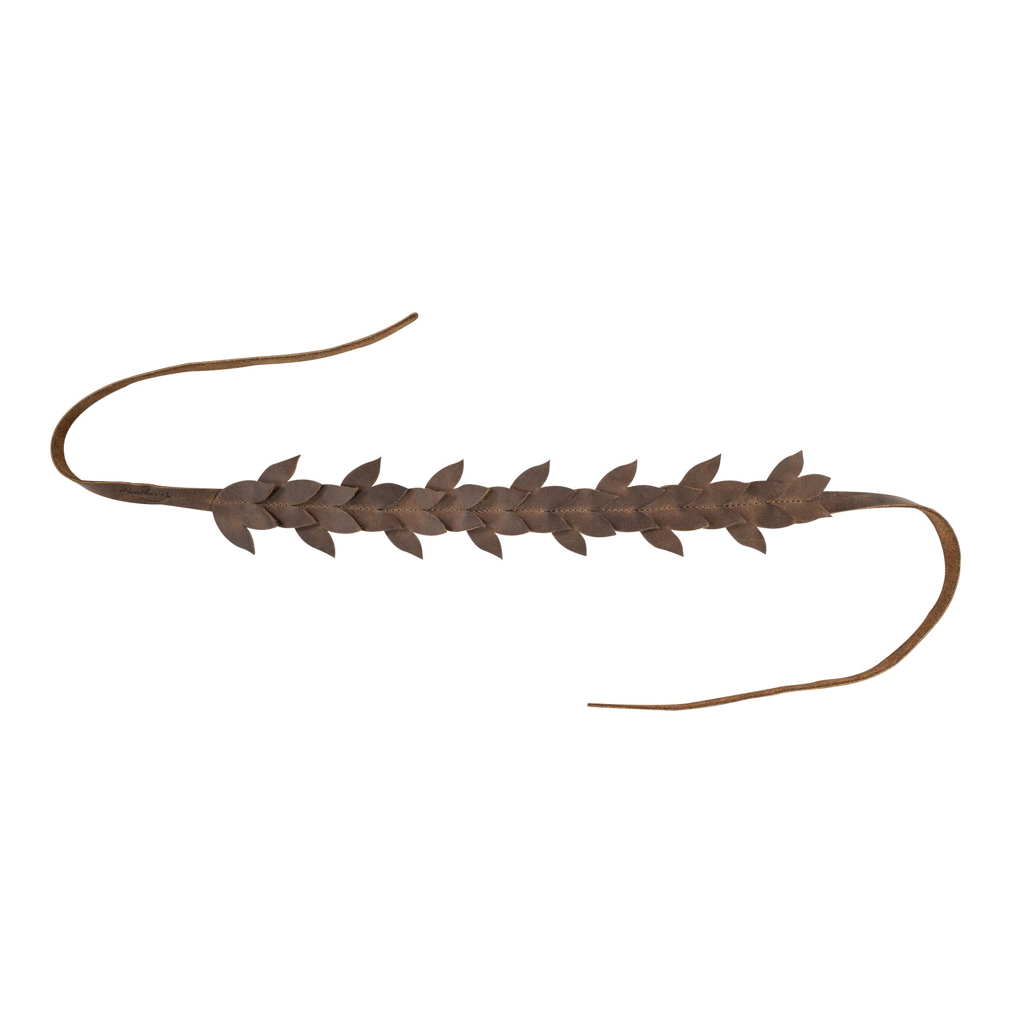 A flat view of Heather's Flowered Headband, this rustic headband features a unique leather floral design. Perfect for women looking for a fashionable hairband or headpiece. With its artisan craftsmanship, this full grain leather crown symbolizes small batch production and handmade quality from La Antigua Guatemala.