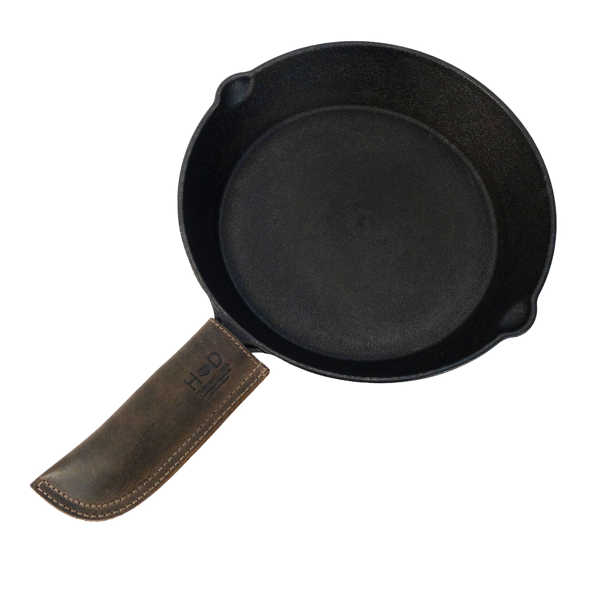 Hide & Drink Cast Iron Panhandle Cover featured prominently to showcase its quality. This artisan hot handle protector made from full grain leather is double stitched for enhanced durability. Handmade in La Antigua Guatemala & Oaxaca Mexico, it’s a stylish and functional addition to any chef’s toolkit.
