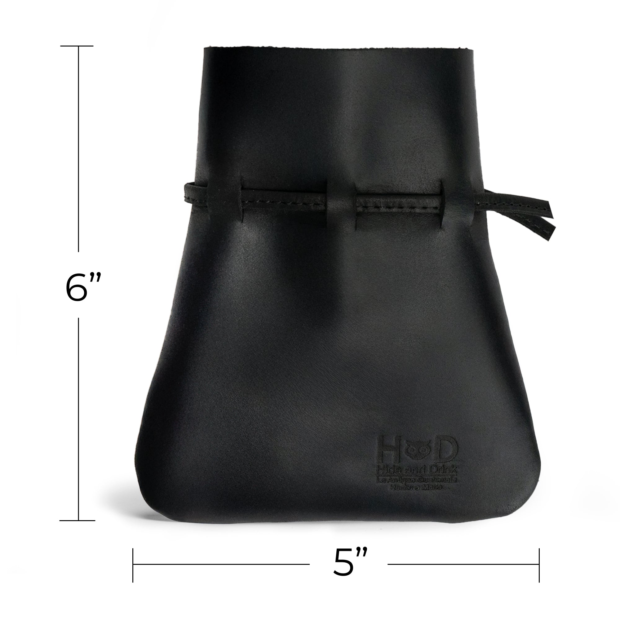 Dimensions of the sleek black Medieval Coin Pouch by Hide & Drink are depicted here, measuring 6 by 5 inches. This Medieval Drawstring Coin Pouch is a perfect accessory for cosplay lovers, crafted from durable Full Grain Leather. Artisan handmade to reflect small batch production in La Antigua Guatemala & Oaxaca Mexico.