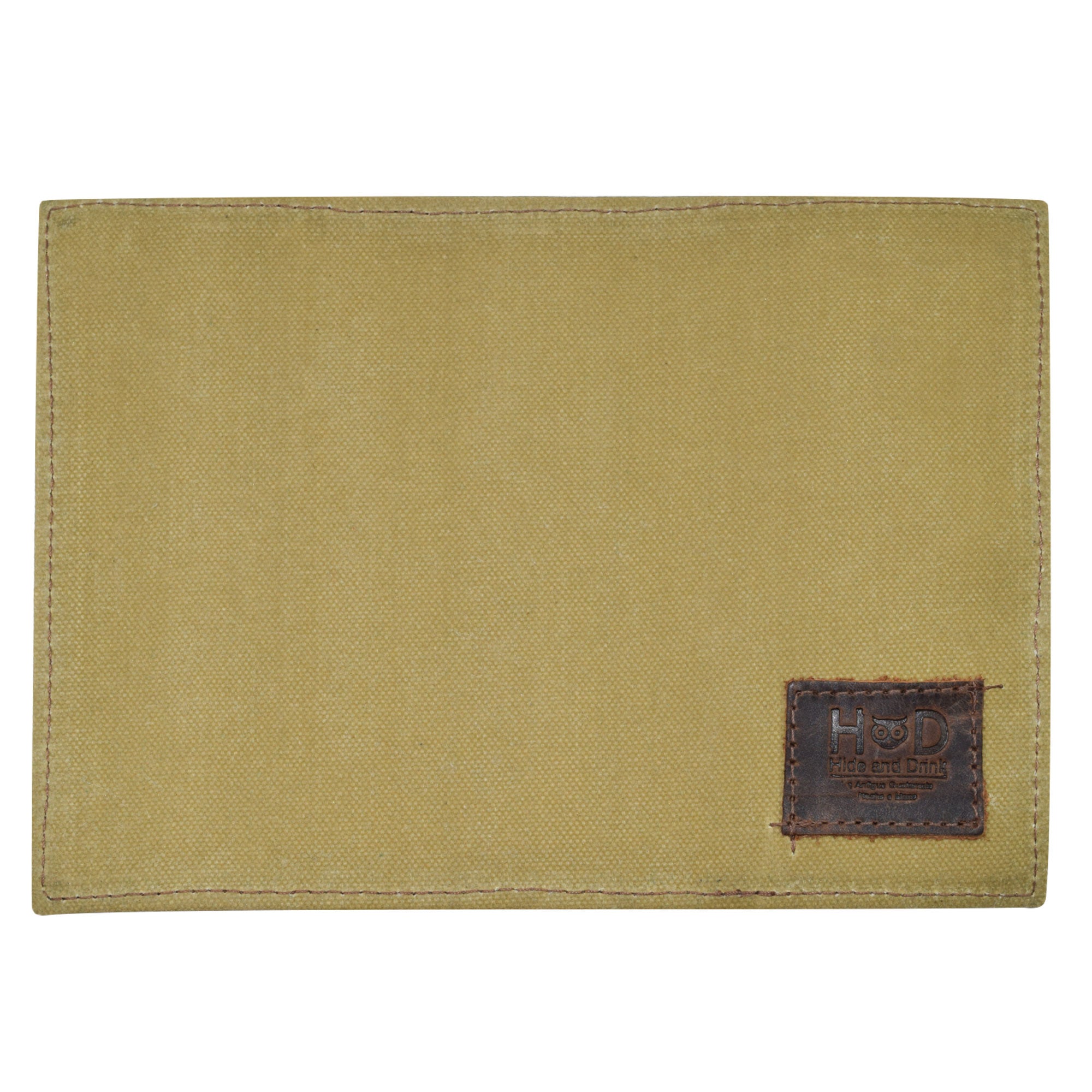 The front of the Hide & Drink Waxed Canvas Field Notes Cover displaying a sleek design and the brand's logo. This versatile Waxed Canvas Field Notes Cover offers functionality for travelers and daydreamers, featuring a Wallet Case (3.5 x 5.5 in.) Journal Cover made through artisan processes.