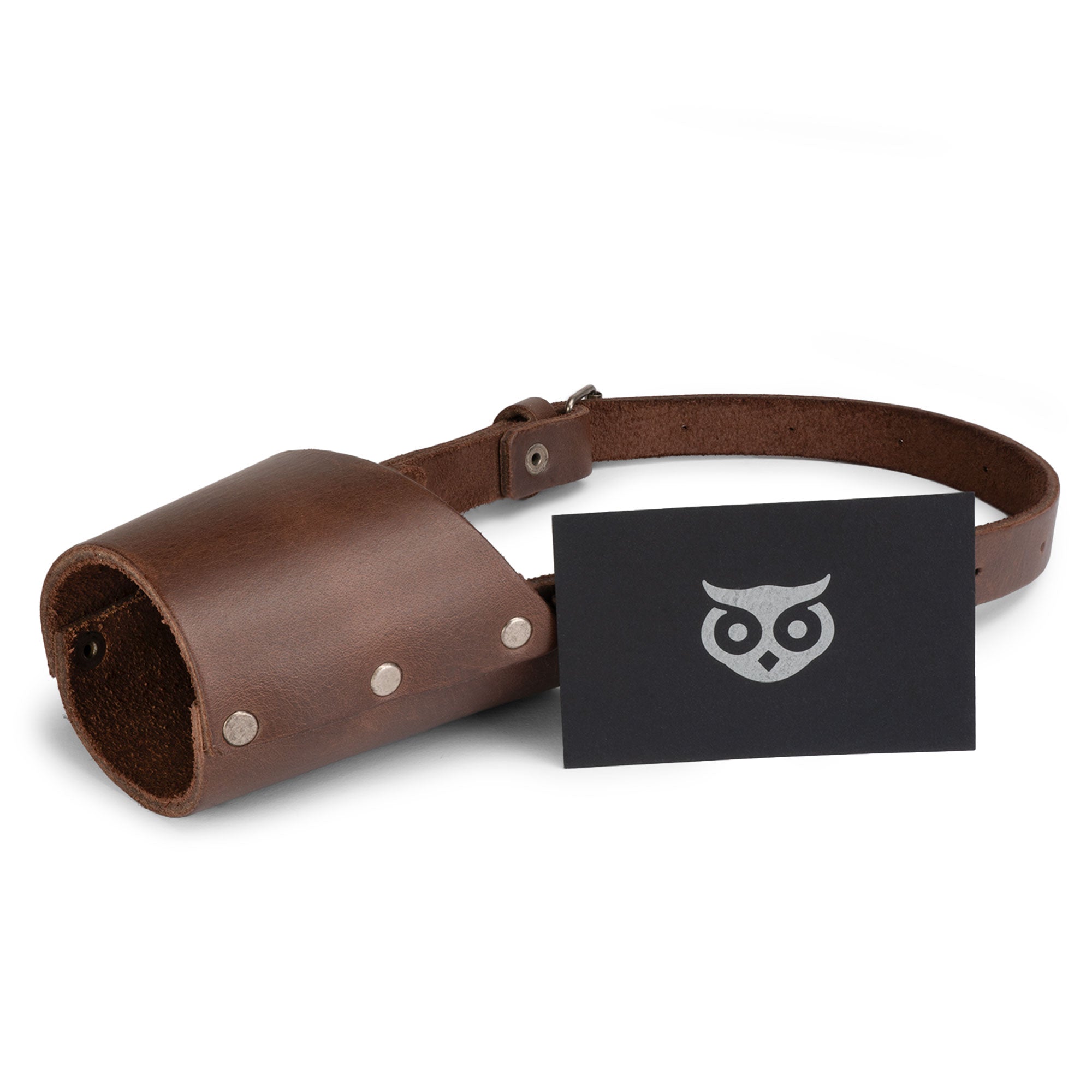 Close-up of the Riveted Dog Muzzle by Hide & Drink, illustrating its secure design for dog control to prevent biting. With its full grain leather and artisan construction, this muzzle guard is perfect for all breeds such as Pitbulls and German Shepherds, handmade in La Antigua Guatemala & Oaxaca Mexico.