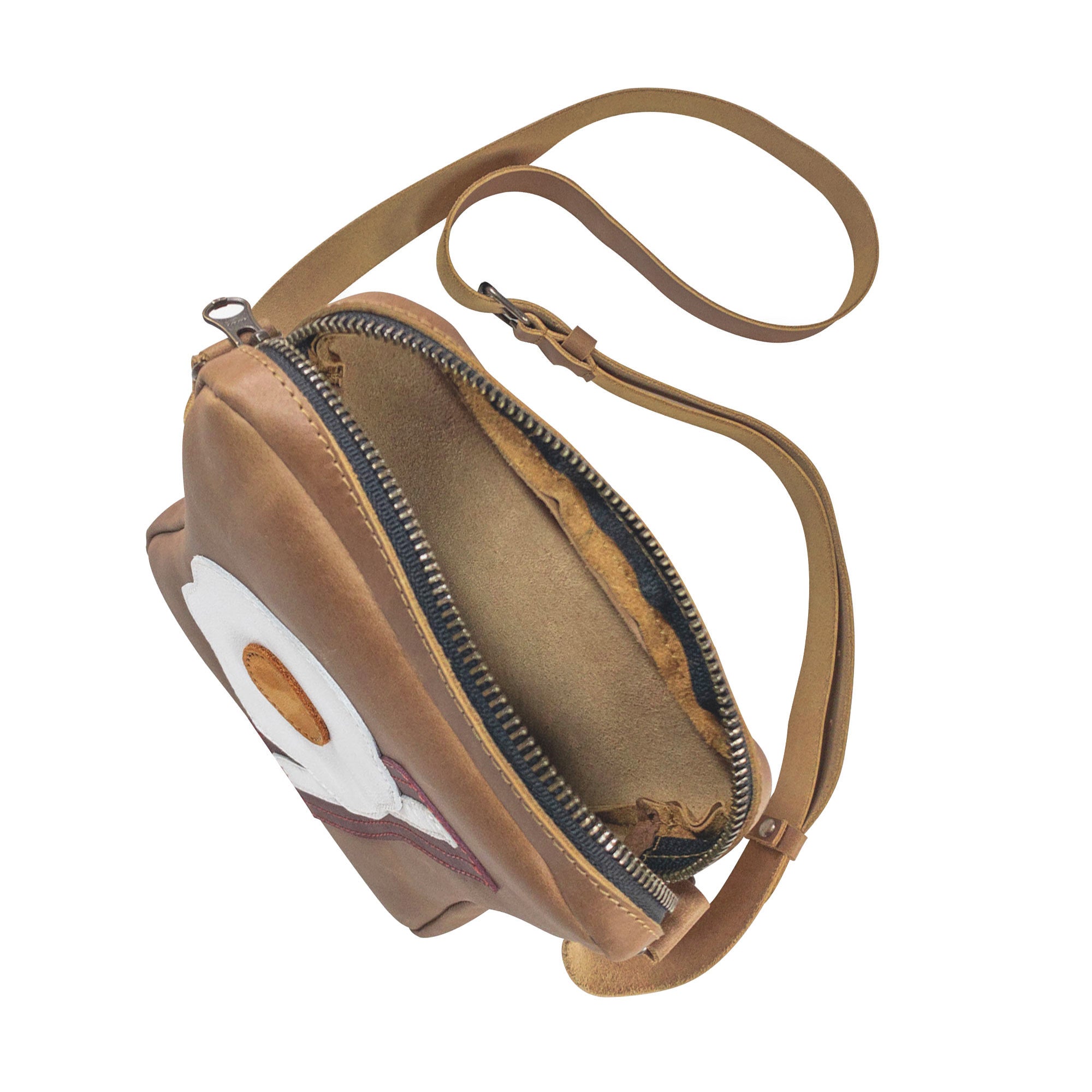 Interior view of the Egg and Bacon Sandwich-Shaped Shoulder Bag by Tudi Frudi, highlighting its practical design and spaciousness. This Handbag, Crossbody Bag, or Messenger Bag is made from Full Grain Leather, showcasing artisan craftsmanship with Hand Cut and Hand Sewn details, made in La Antigua Guatemala.