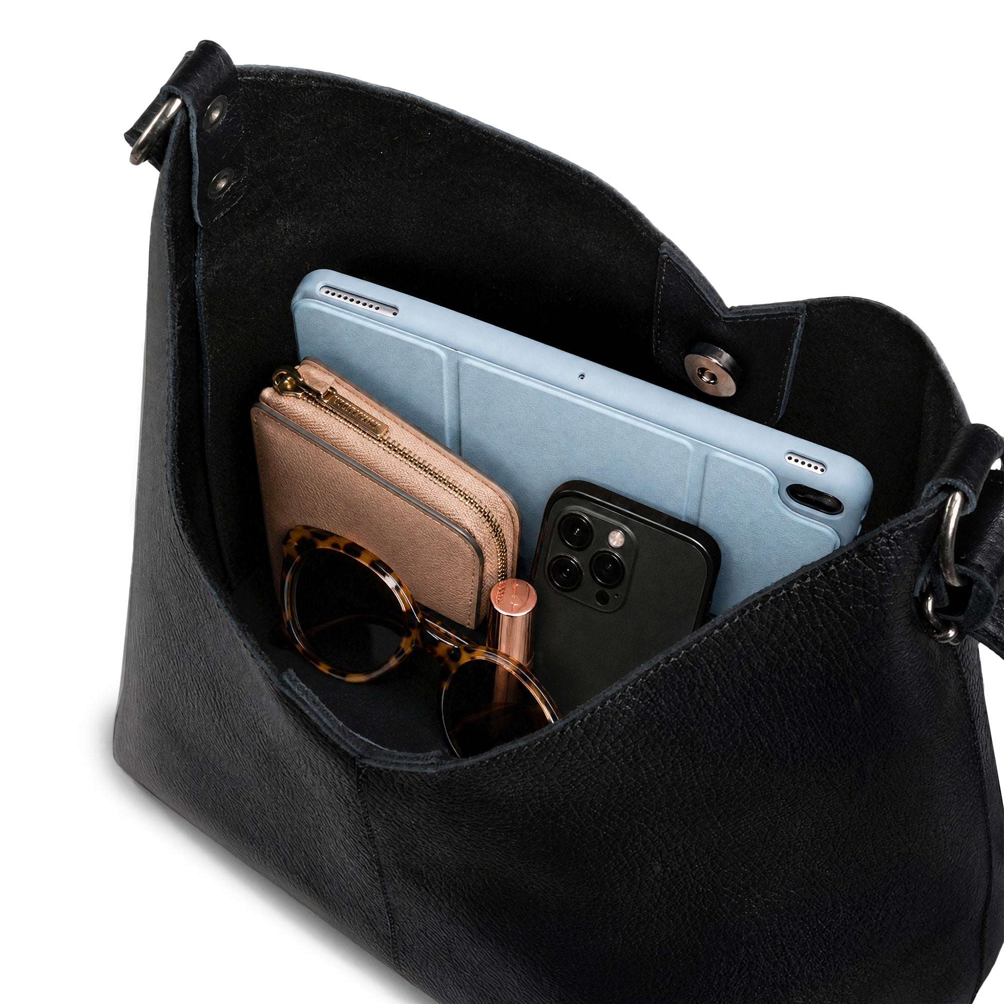 Top view of the Austin Genuine The Tarrytown Hobo Bag showing its open interior and room for everyday essentials. The Tarrytown Hobo Bag Full Grain Leather, StockyardX, Small Batch Production, Hand Cut, Hand Sewn, Fire Branded, Artisan, Handmade in La Antigua Guatemala & Oaxaca Mexico.
