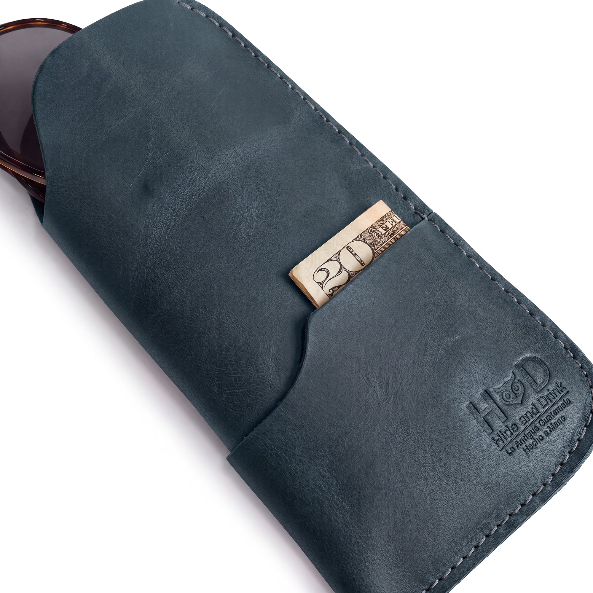 Stylish profile of the Hide & Drink Sunglass Case & Wallet, emphasizing its handcrafted quality. This Rustic Sunglasses Case & Wallet features Full Grain Leather for a luxurious feel while offering great protection for your eyeglasses during travel, artisanal nods from La Antigua Guatemala & Oaxaca Mexico.