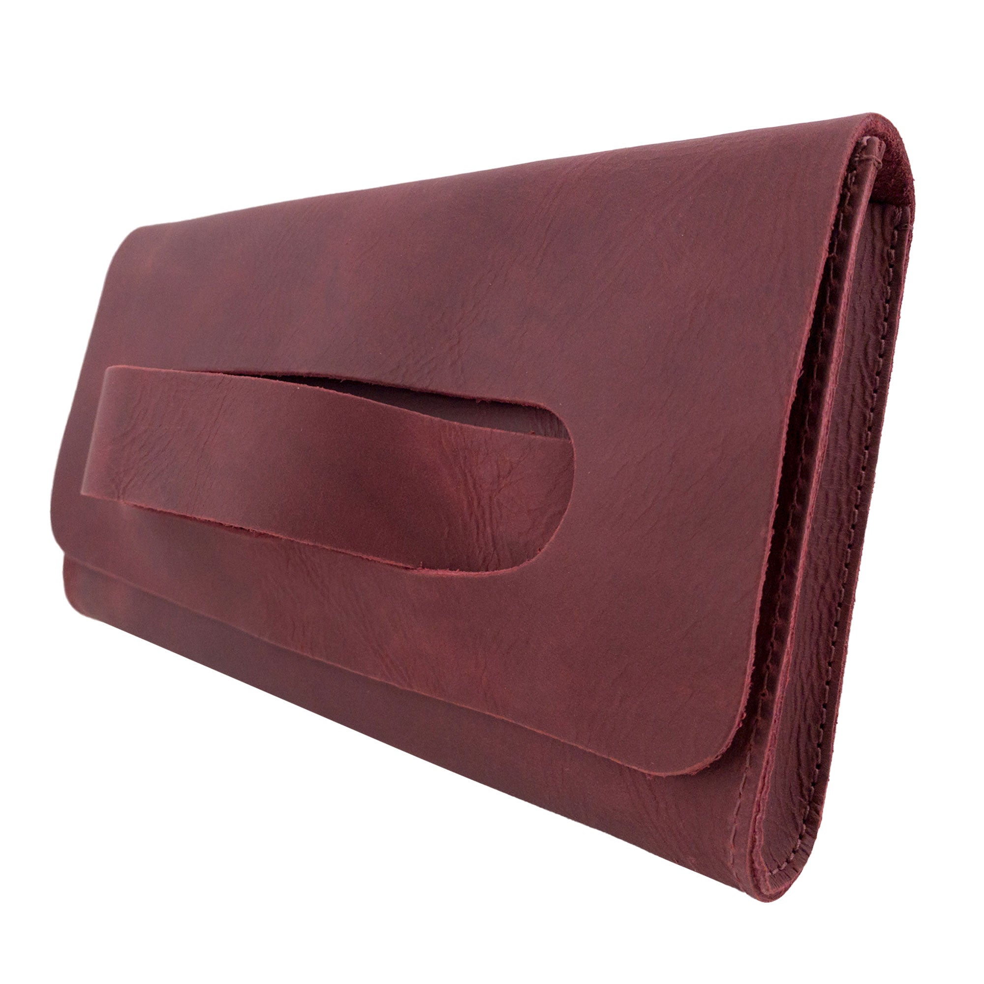 Side view of the maroon Clutch Bag With Handle from Hide & Drink, showcasing its beautiful design. Made from durable Full Grain Leather, this Clutch Bag with Handle is an elegant choice for women, handmade in La Antigua Guatemala & Oaxaca Mexico.