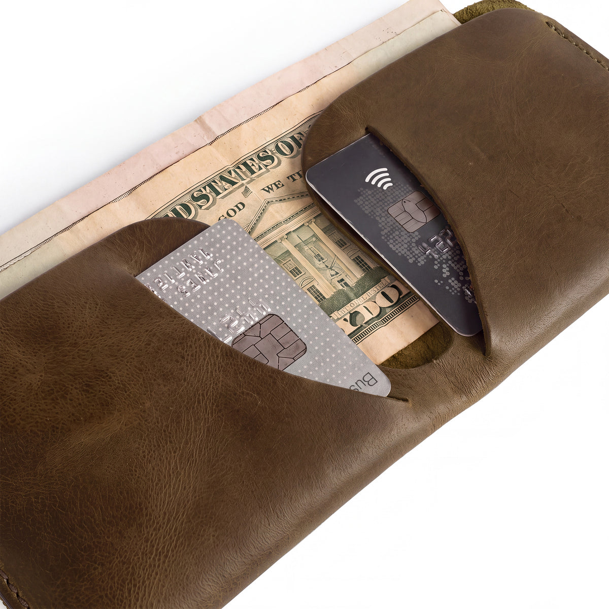 The Hide & Drink Minimal Wallet shown with currency, showcasing its practicality as a Full Grain Leather Classic Slimfold Wallet. Designed as a Card Organizer Holder and Travel Accessory, it represents Small Batch Production quality by artisans in La Antigua Guatemala & Oaxaca Mexico.