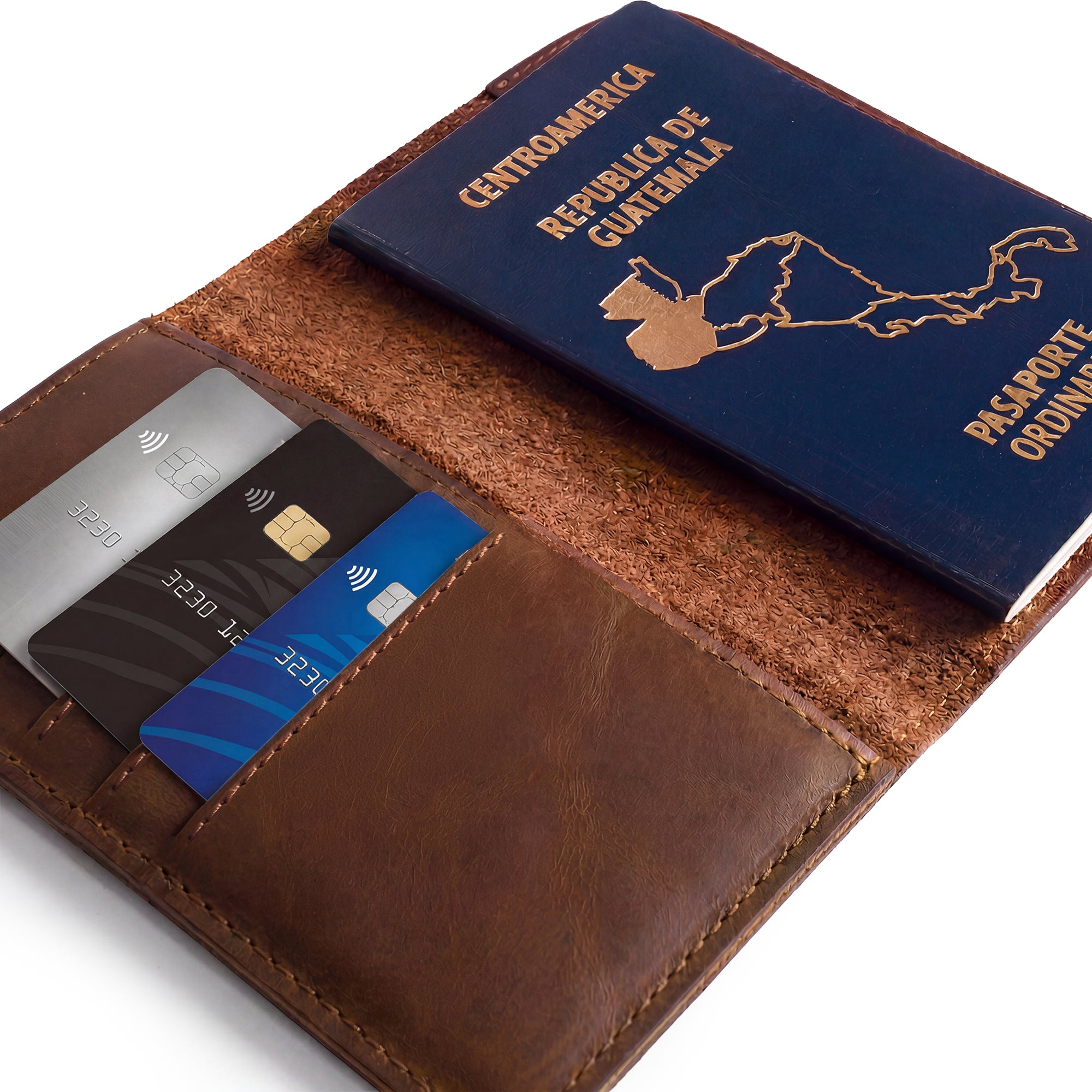Inside view of the Hide & Drink Travel Wallet showing its pocket layout. This versatile travel wallet is a bifold passport case and card holder, made from premium leather in La Antigua Guatemala.