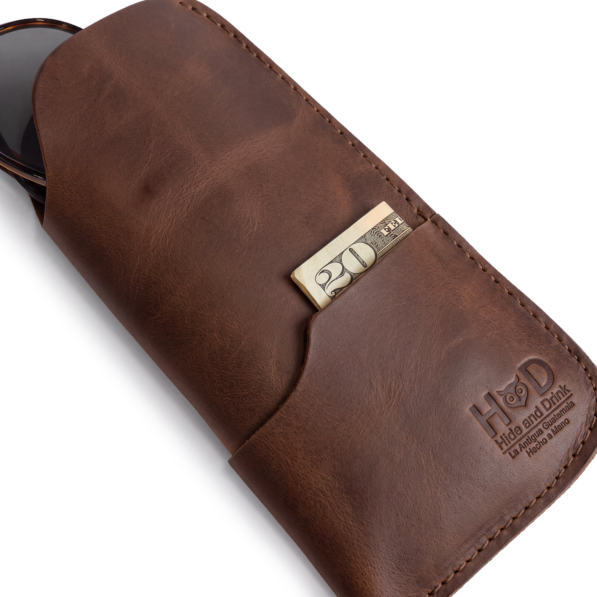 An impressive view of the Hide & Drink Sunglass Case & Wallet, a perfect blend of functionality and style. This Rustic Sunglasses Case & Wallet is handcrafted from Full Grain Leather, ideal as a glasses protector for travel, made in La Antigua Guatemala & Oaxaca Mexico.