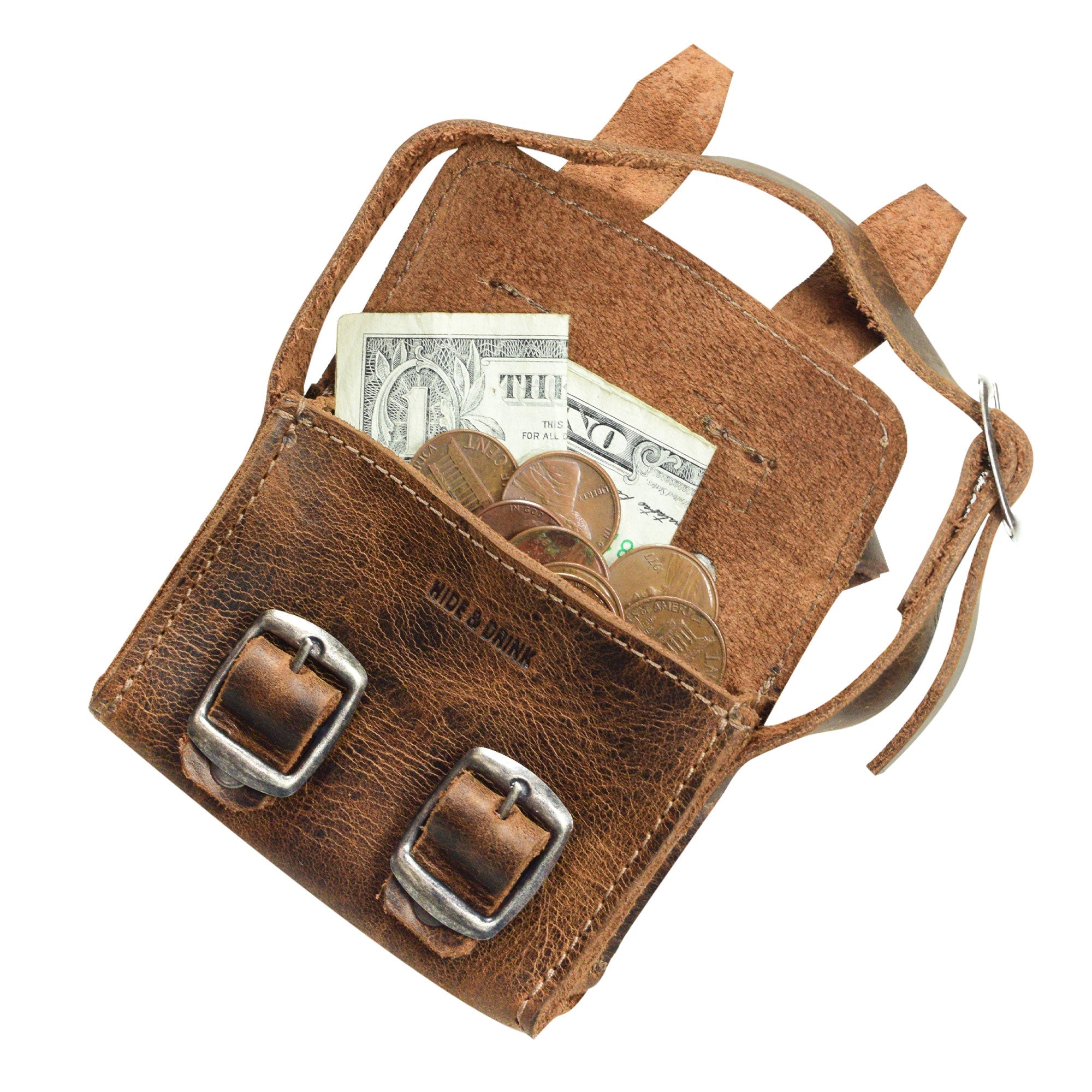 Inside view of the Tiny Messenger Bag by Hide & Drink, showcasing this Mini Messenger Bag Charm's unique design with cash and coins. Crafted from durable Full Grain Leather, this keychain is an artisan piece made in La Antigua Guatemala, reflecting small batch production and careful hand craftsmanship.