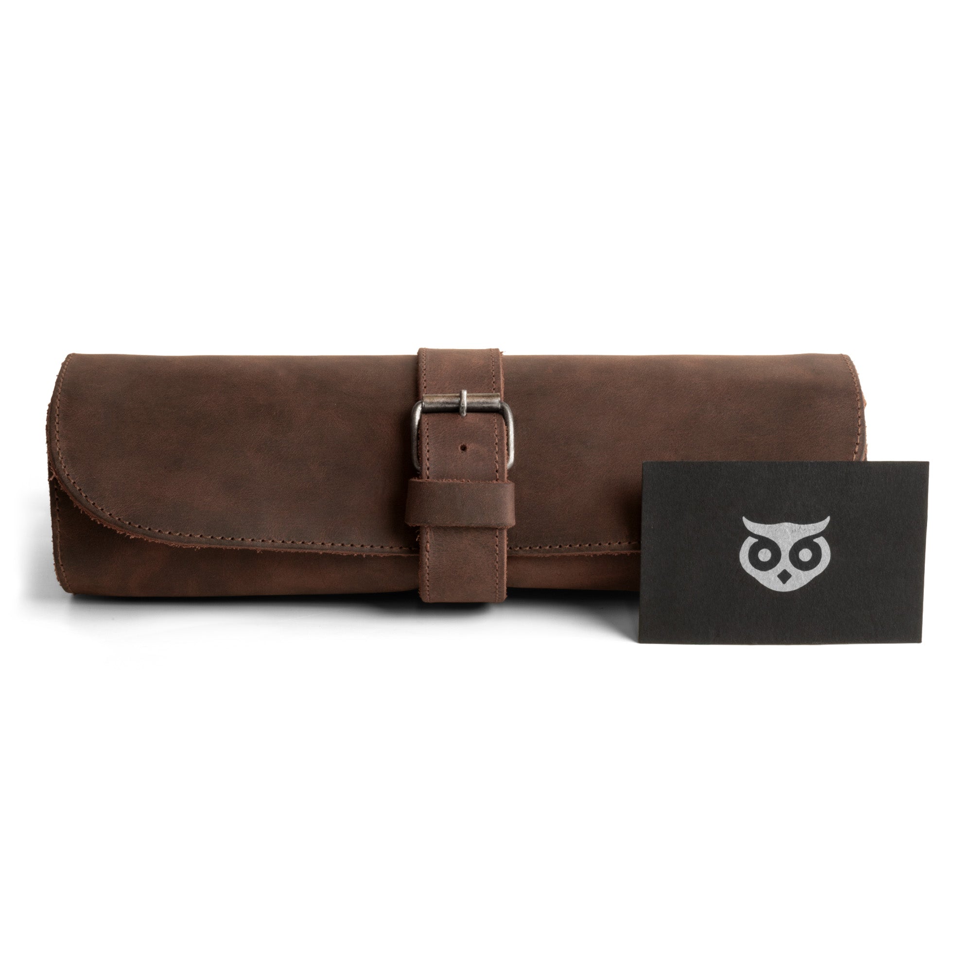 The stylish exterior of the Cylinder Watch Case by Hide & Drink, featuring a secure buckle closure. This Full Grain Leather storage box is ideal for organizing watches while traveling. Handmade with attention to detail, each case is part of small batch production that highlights hand cut, hand sewn quality, proudly crafted by artisans in La Antigua Guatemala & Oaxaca Mexico.