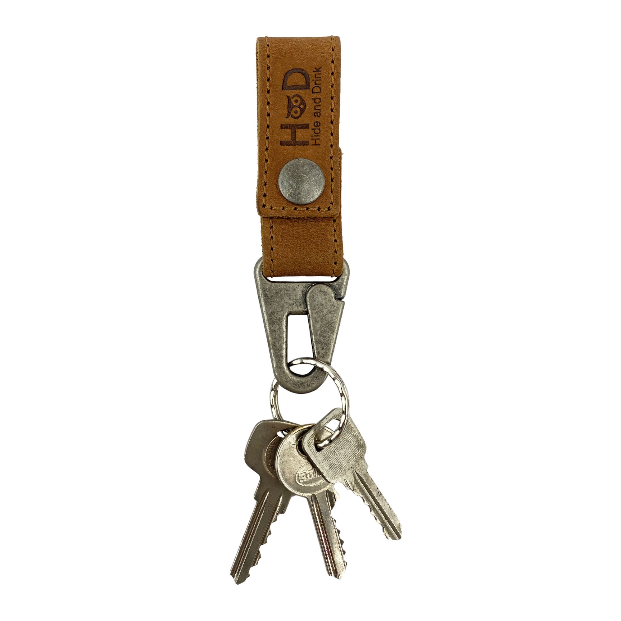 Key Ring Holder by Hide & Drink with keys attached, showcasing its practicality and style. Made from Full Grain Leather, this holder reflects Small Batch Production and excellent craftsmanship. Handmade in La Antigua Guatemala & Oaxaca Mexico.