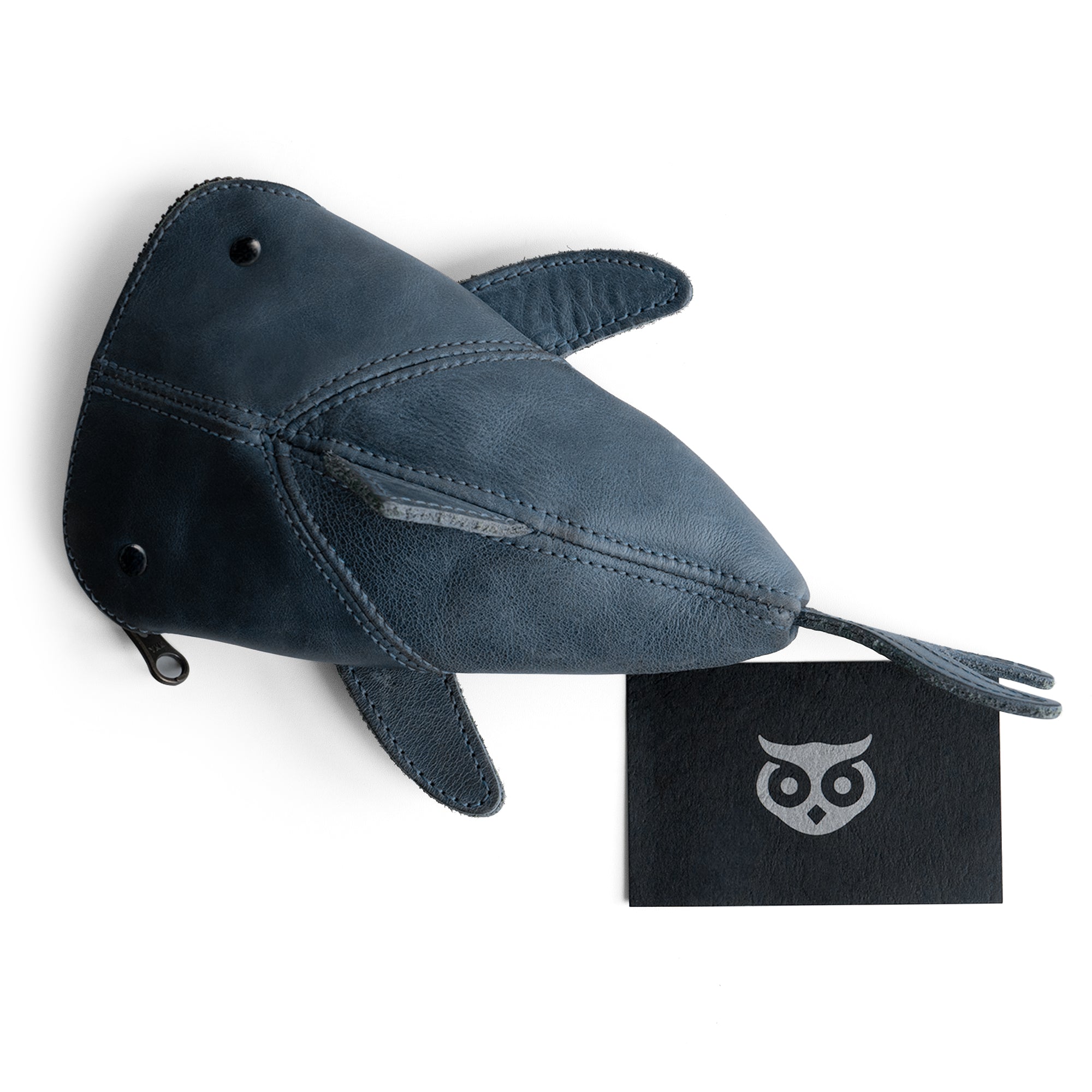 Top-down perspective of a brown Leather Shark Pouch from Hide & Drink, emphasizing its zippered feature. This versatile shark shaped case makes an ideal pencil purse or zippered coin pouch. Artisan crafted from full grain leather in La Antigua Guatemala & Oaxaca Mexico, it reflects quality and small batch production.