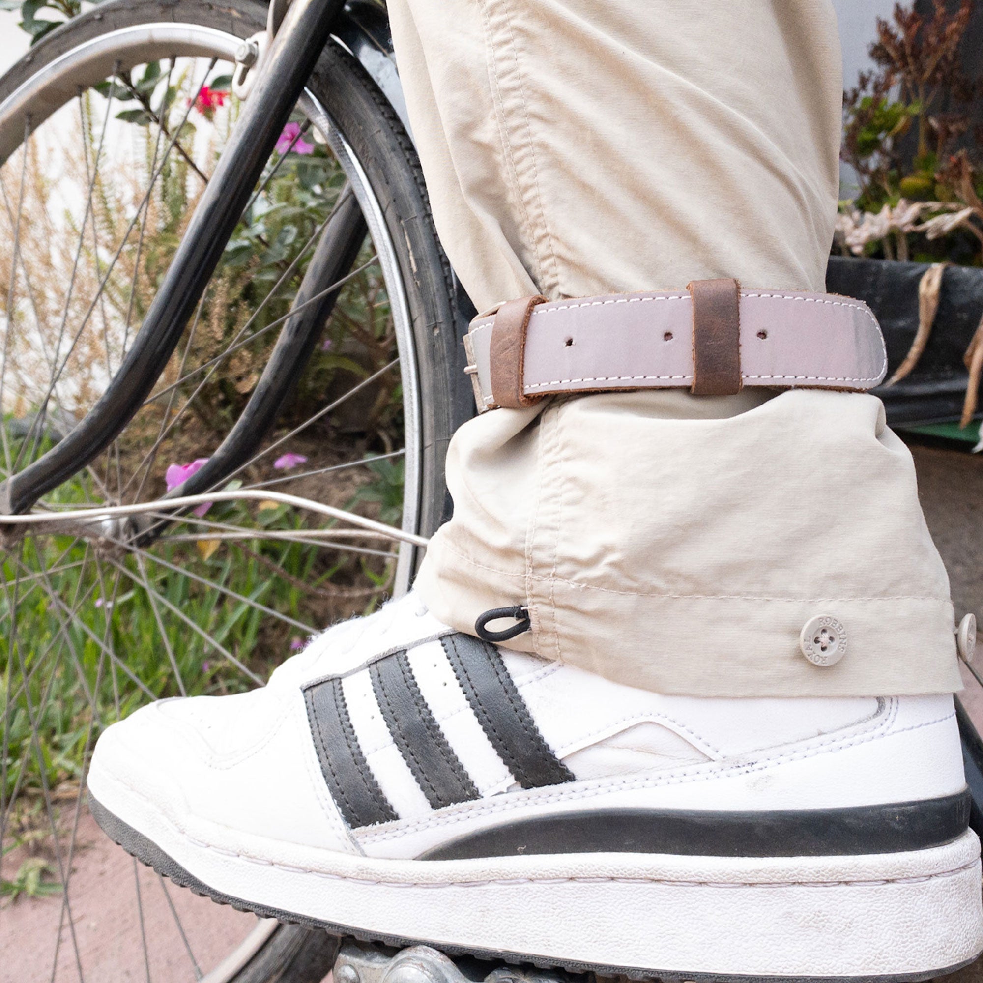 Bicycle Ankle Bands by Hide & Drink, highlighting a stylish pair of Rustic Bicycle Ankle Bands equipped with a reliable Brass Metal Buckle. These Adjustable Straps for Legs made from Full Grain Leather are ideal as Vintage Gifts for Cyclists, handmade with care in La Antigua Guatemala.