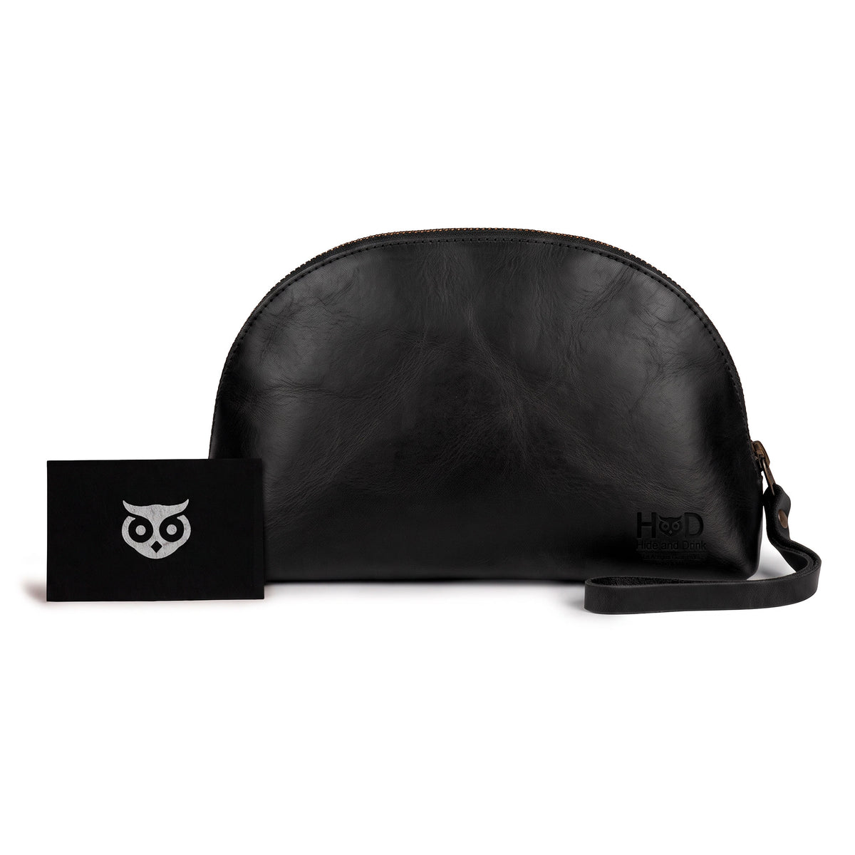 Accessory Pouch Organizer Hand Bag by Hide & Drink in black leather, accompanied by business cards emphasizing craftsmanship. This Cosmetic Travel Organizer with Hand Strap for Women acts as a versatile Makeup Bag and Classic Handbag, handmade in La Antigua Guatemala & Oaxaca Mexico.