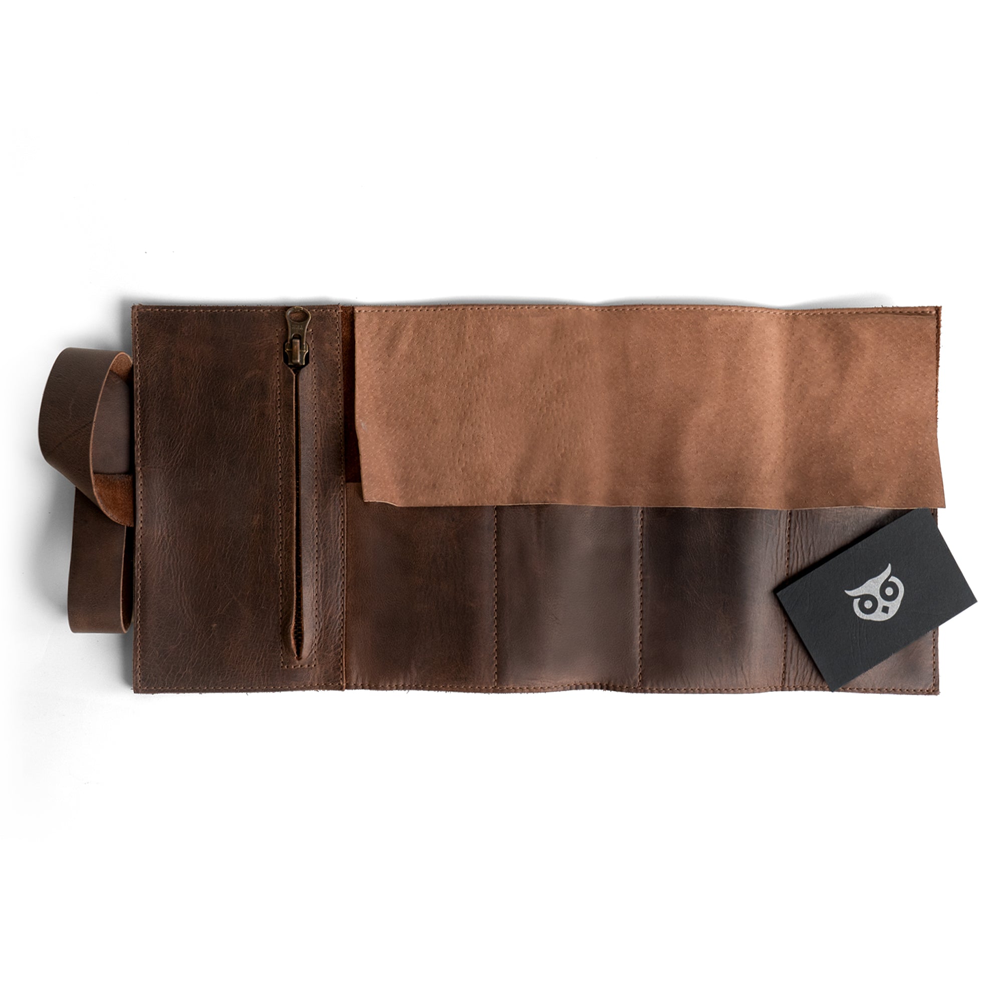Hide & Drink Premium Watch Roll showcasing its interior design with a zippered pouch, ideal for organizing watches. Made from full grain leather, this watch roll organizer is a stylish travel essentials gift that benefits from small batch artisan production in La Antigua Guatemala and Oaxaca Mexico.