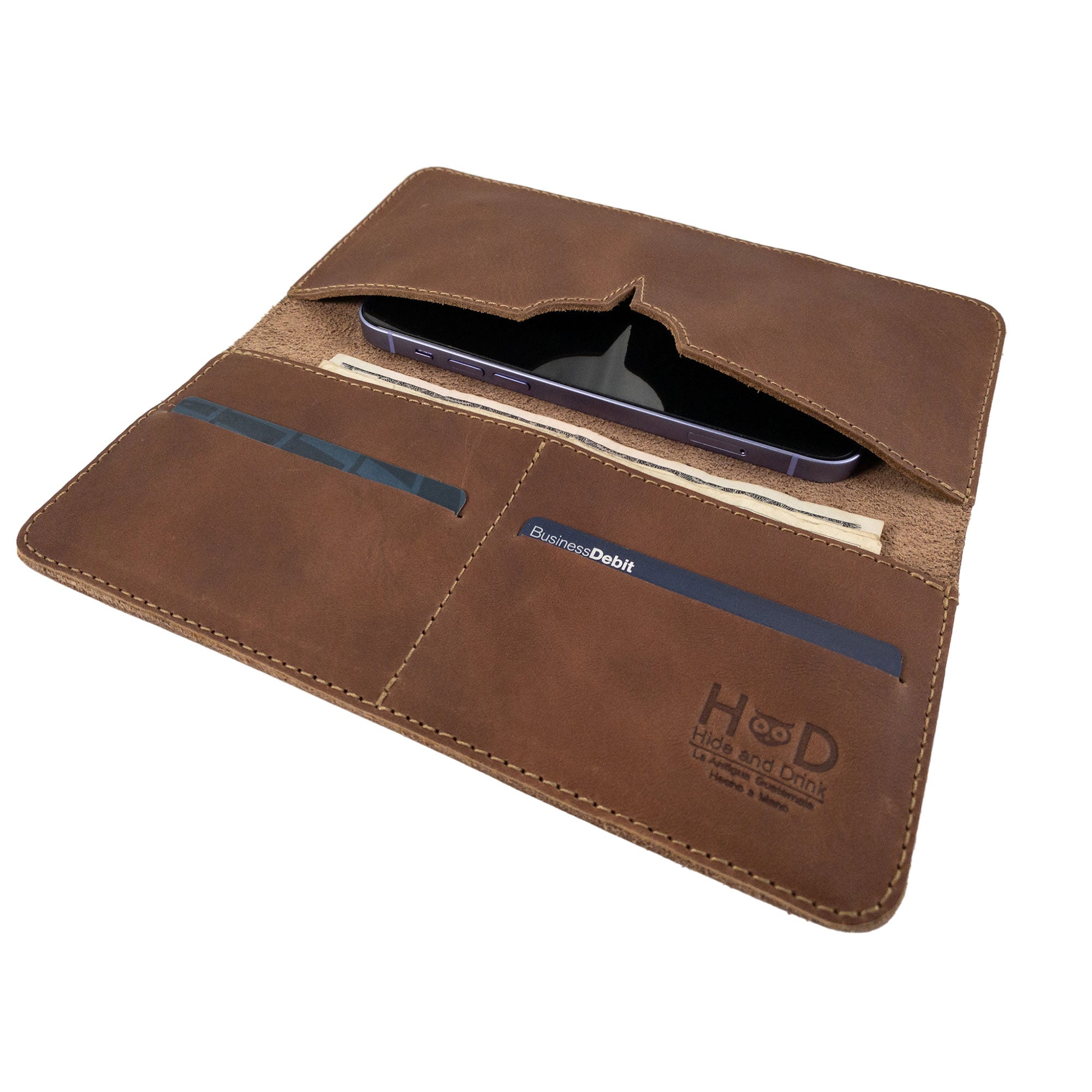 An image illustrating the dimensions of the rustic bifold wallet for cellphone by Hide & Drink. This infographic showcases the practical size of the Bifold Wallet for Cellphone made from Full Grain Leather. Each piece reflects artisan work through small batch production in La Antigua Guatemala & Oaxaca Mexico.