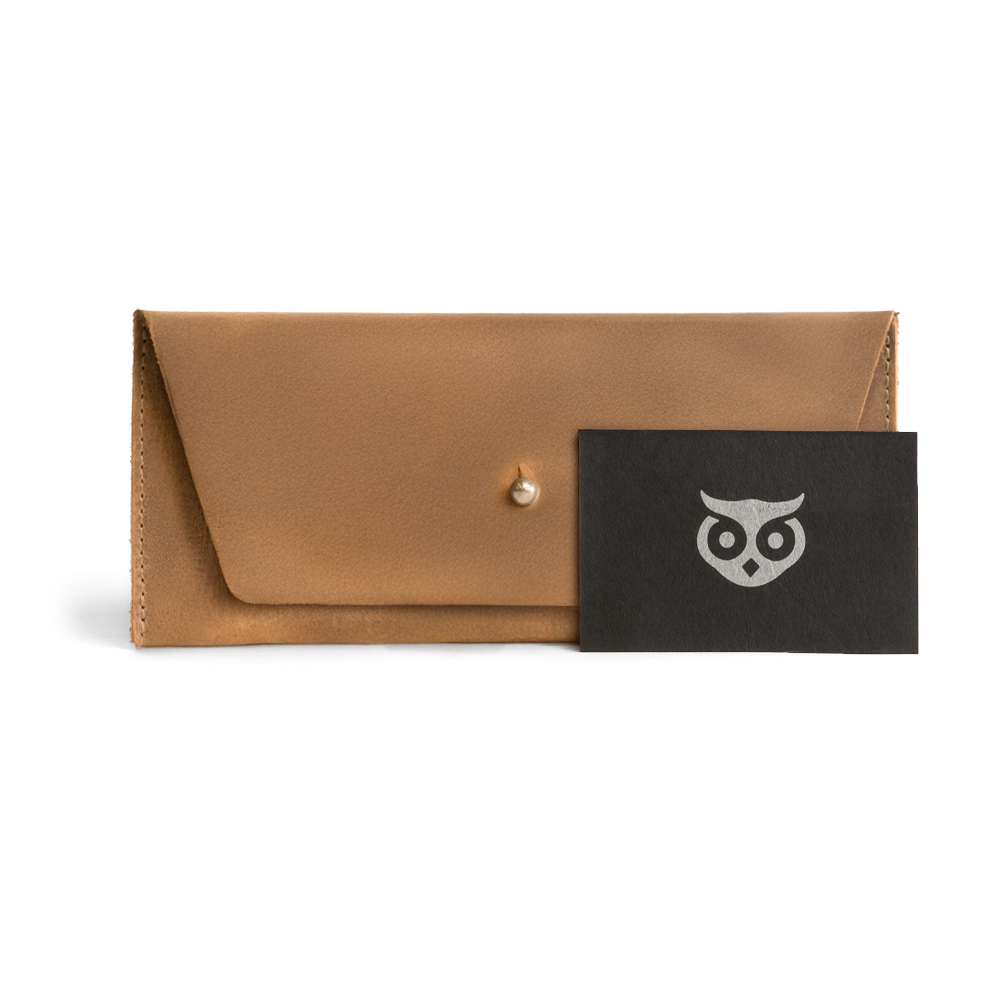 Showcasing the navy blue Long Utility Pouch by Hide & Drink with a gift card, perfect as a thoughtful gift option. Great for stylishly carrying cash and cards.