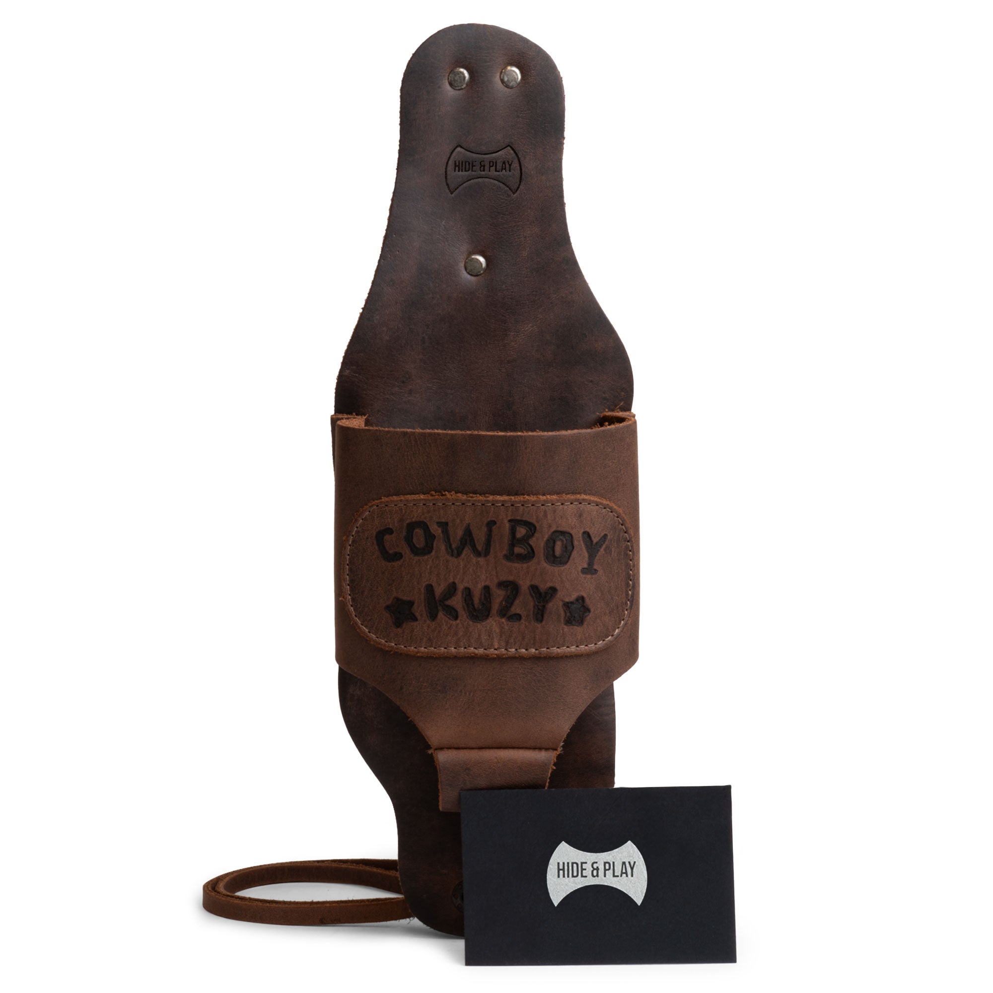 Cowboy Beer Holster by Hide & Play with tags displayed, emphasizing the artisanal craftsmanship and quality materials used in its creation. This Cowboy Beer Holster - Handsfree Beverage Holder, Bottle Leg Grip, Old School, Men's Party Gift Gear, Full Grain Leather, StockyardX, Small Batch Production, Hand Cut, Hand Sewn, Fire Branded, Artisan, Handmade in La Antigua Guatemala & Oaxaca Mexico.