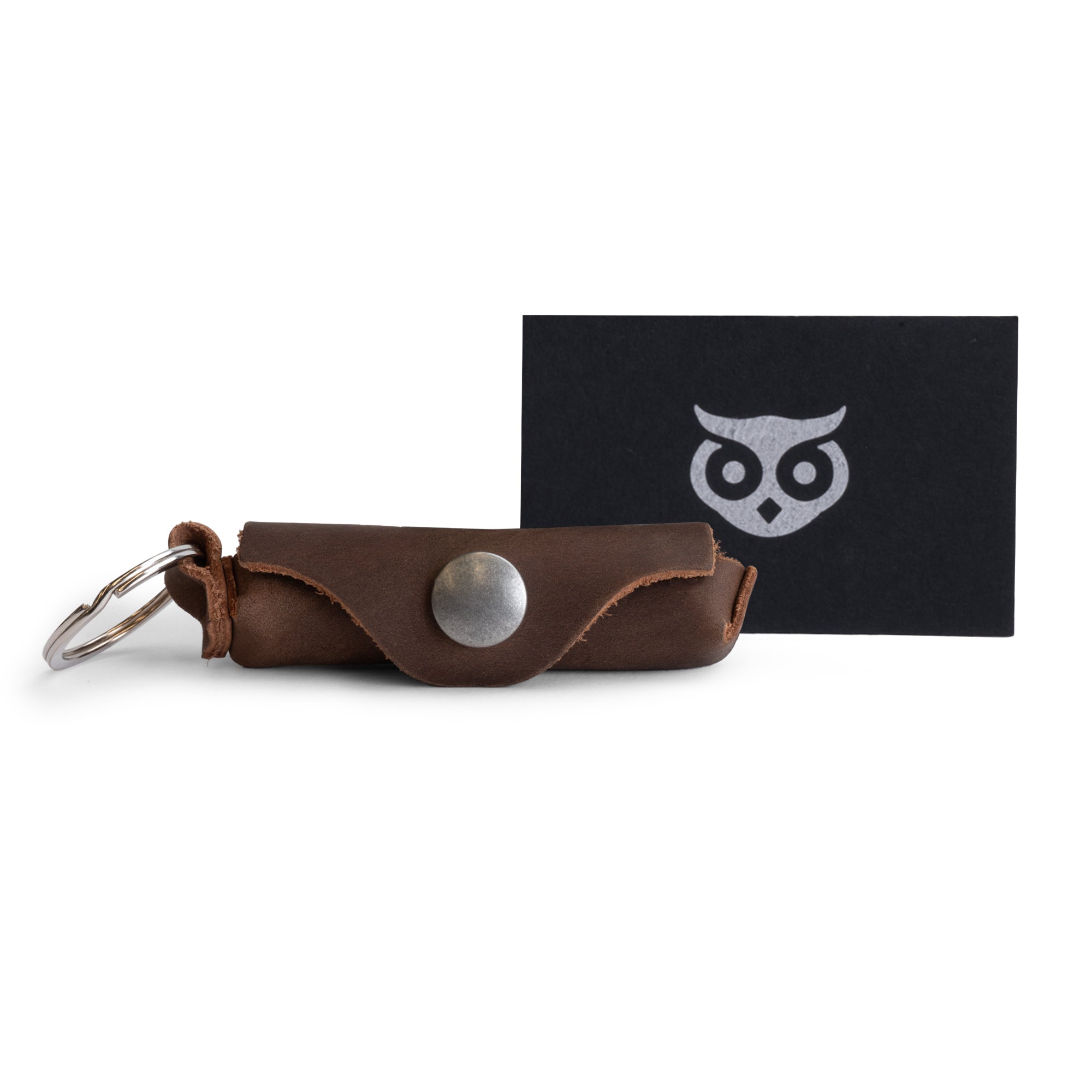 Versatile Lip Balm Key Chain by Hide & Drink featuring a keychain holder for convenient lip balm storage. Made from full grain leather with a classic vintage touch and sturdy brass metal clasp. Handmade in La Antigua Guatemala.