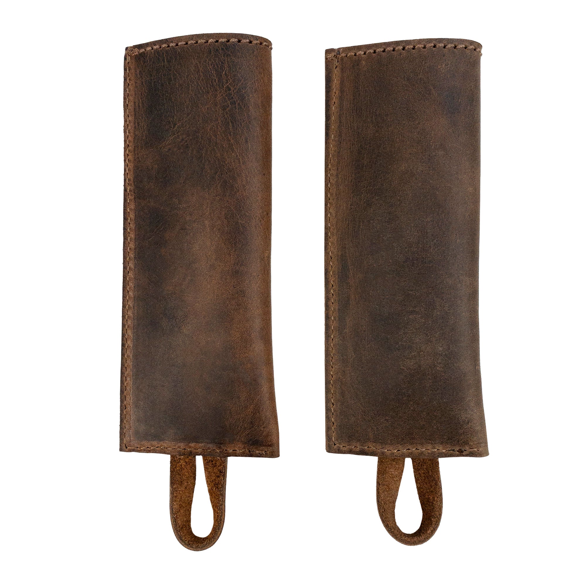 Front view of the Set of 2 Rectangular Pan Handle Covers by Cast Leather Co., showcasing their unique full grain leather design as a sleeve for metal skillet grip. Ideal kitchen accessories, these products are artisan-made through small batch production in La Antigua Guatemala & Oaxaca Mexico.