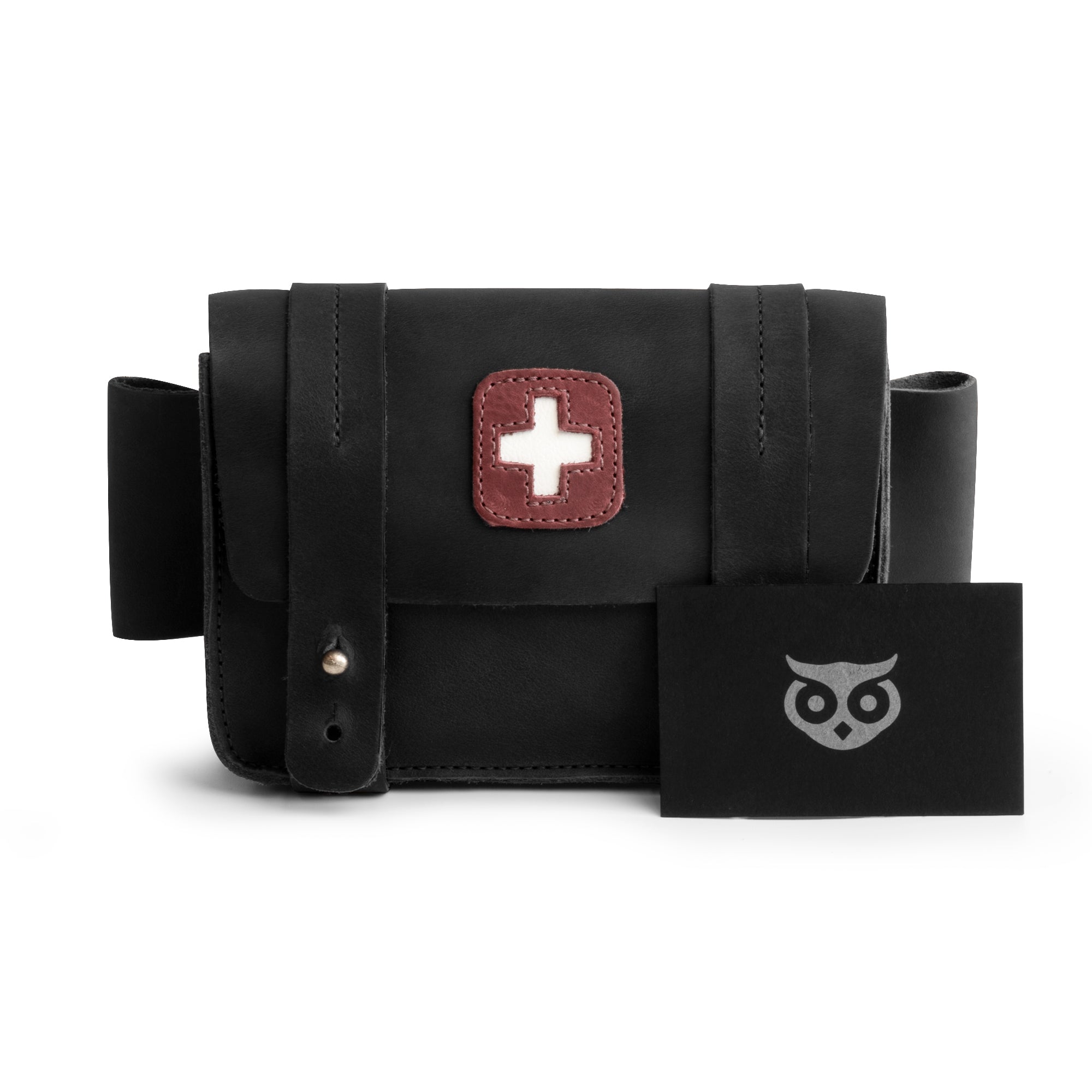 Hide & Drink's black Empty First Aid Bag, Mini Medical Storage Pouch displayed alongside a gift card, emphasizing its thoughtful gifting potential. This Empty First Aid Bag is designed from Full Grain Leather, perfect for small medic pack cases and crafted with love by artisans in La Antigua Guatemala.