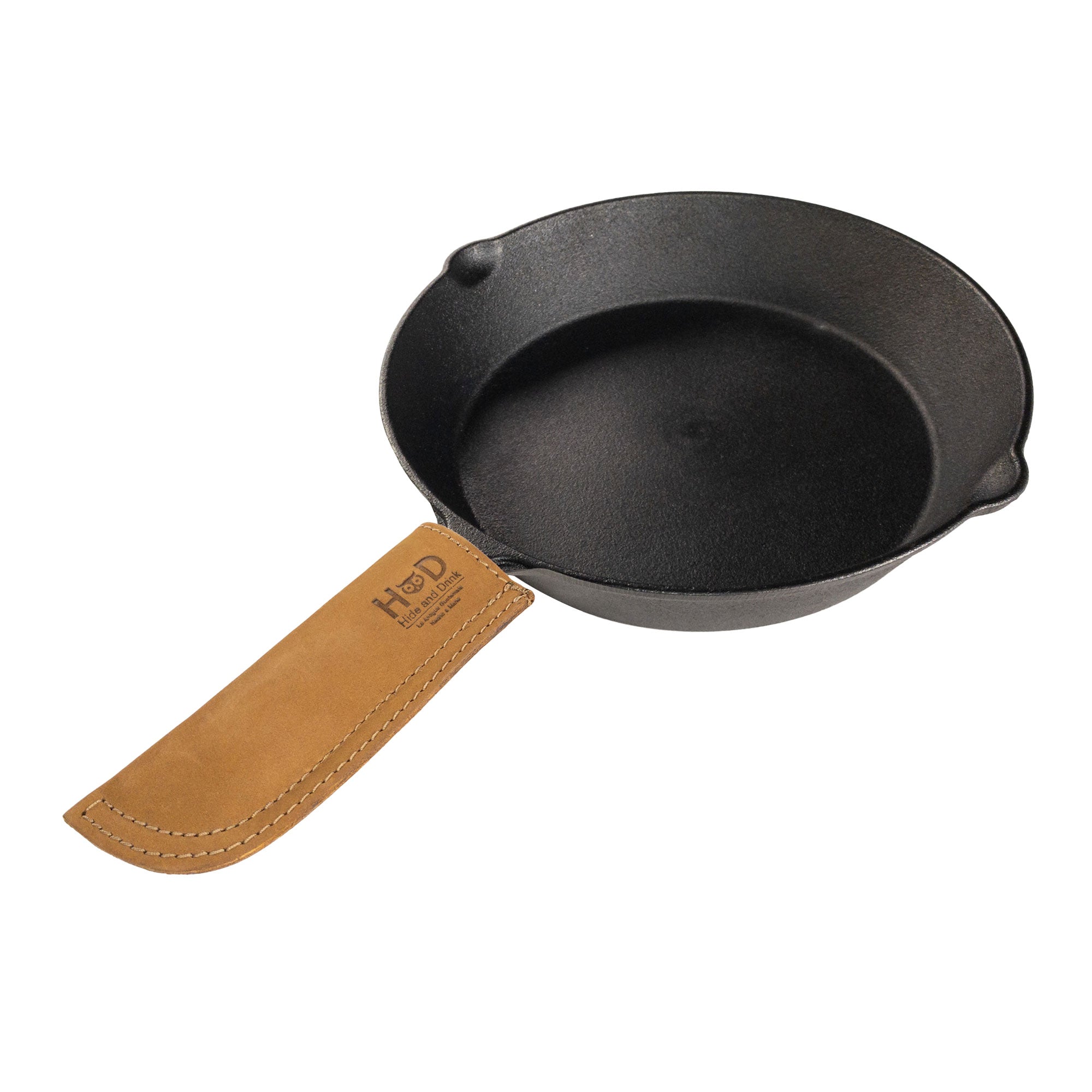 Hide & Drink Cast Iron Panhandle Cover highlighted against a clean background. This artisan hot handle protector is made from durable full grain leather and features a double stitched design. Crafted in La Antigua Guatemala & Oaxaca Mexico, it's perfect for any kitchen setup.