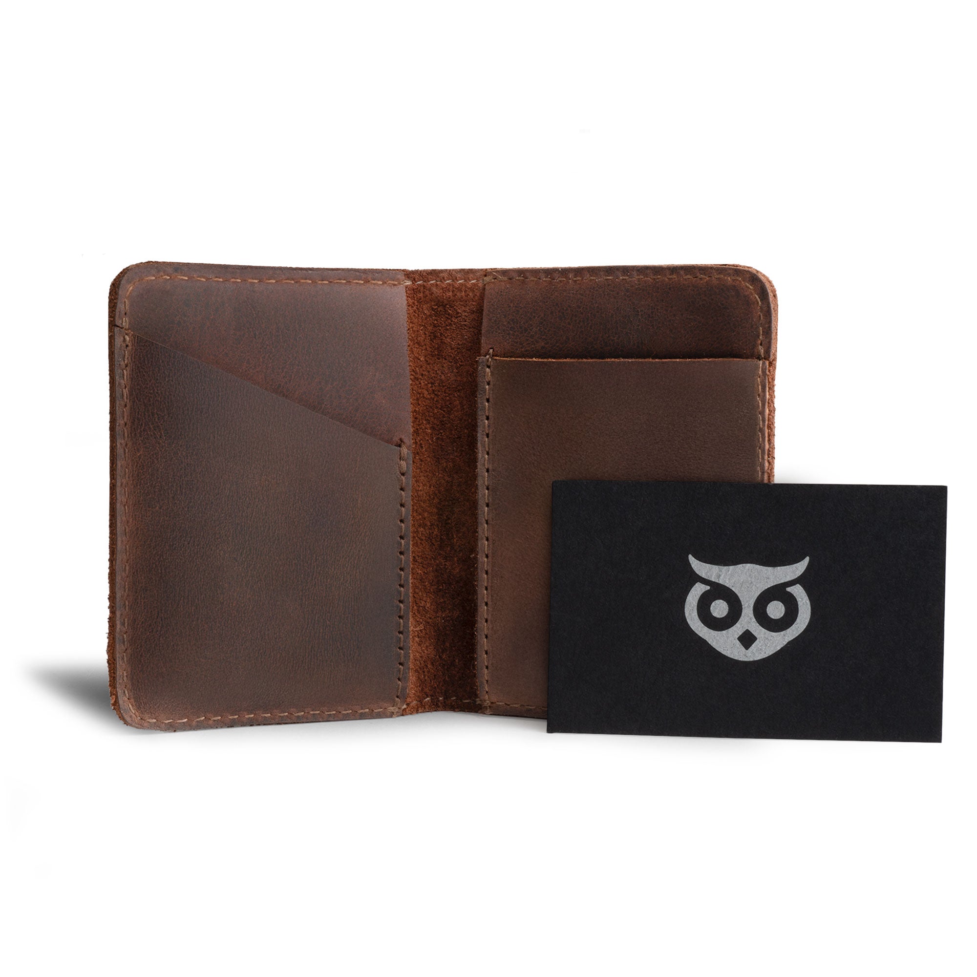 Hide & Drink Bifold Wallet displayed with a business card, emphasizing its elegant design and functionality as a minimalist traveler wallet made from premium full grain leather.