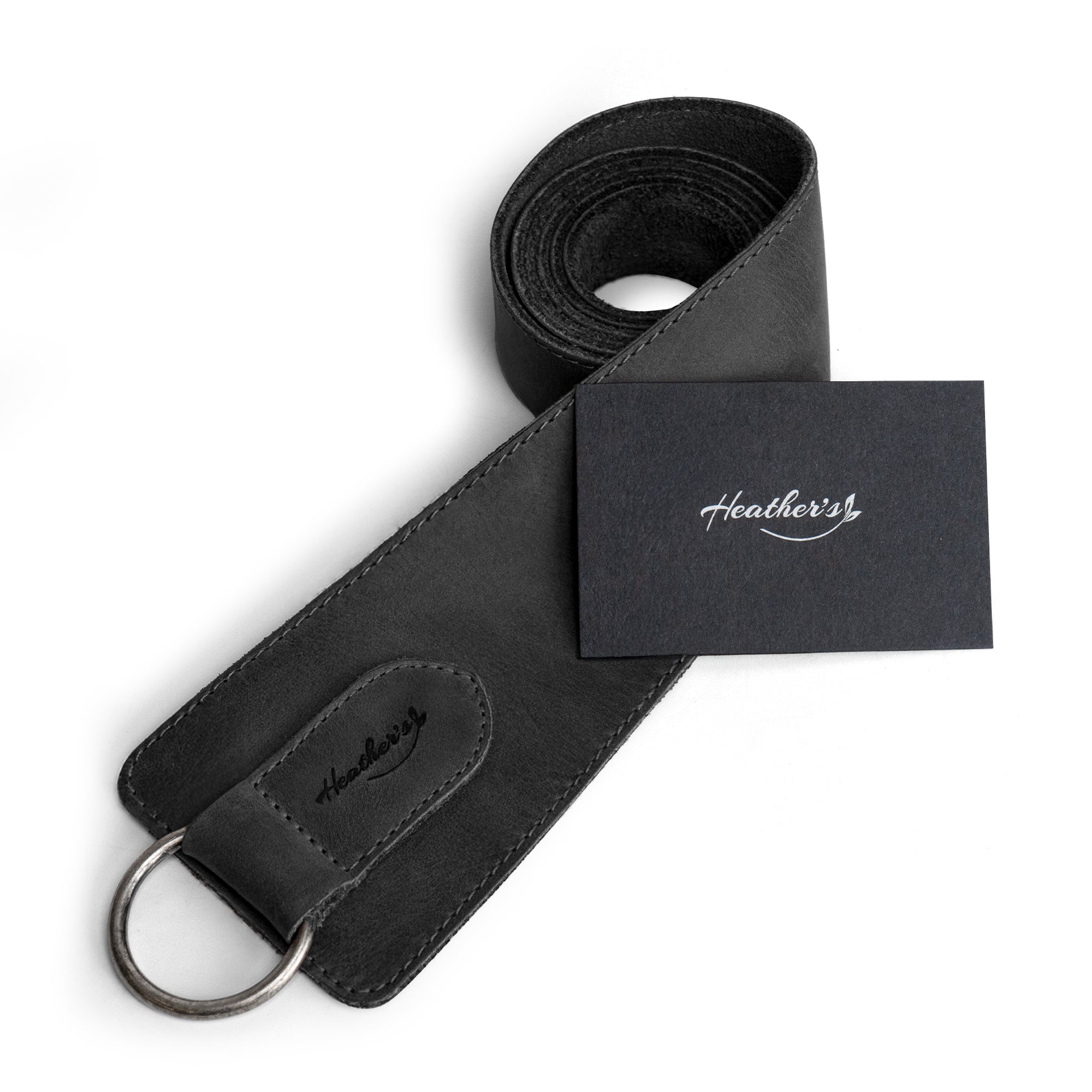 Heather's Formal Belt for Women with Ring in black, elegantly rolled for display. This No-Buckle Belt made of Full Grain Leather represents the artisan work of small batch craftsmanship, hand cut and sewn in La Antigua Guatemala.